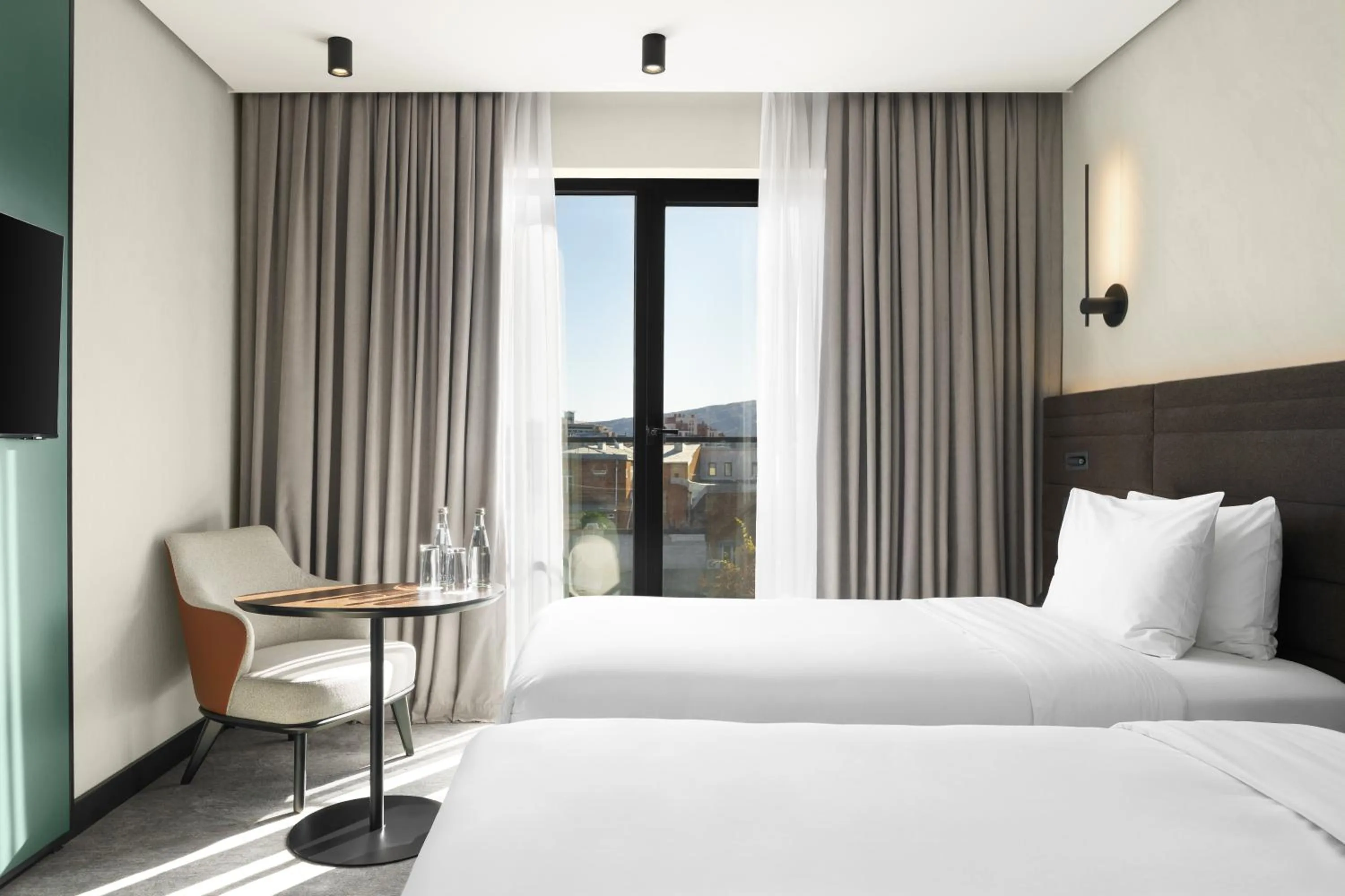 Seating area, Bed in Novotel Tbilisi Center