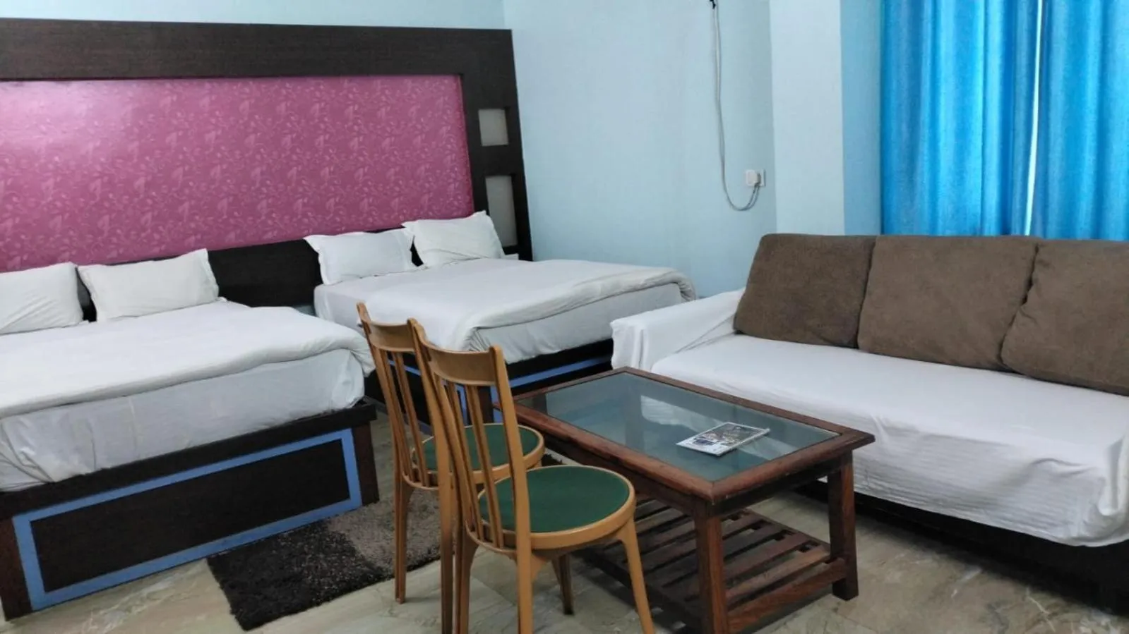 Bed in Hotel Nirmala Inn