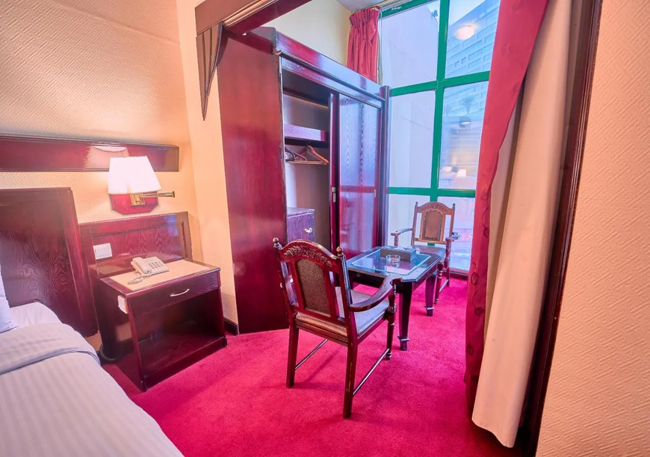 Seating area, Bed in Claridge Hotel Dubai