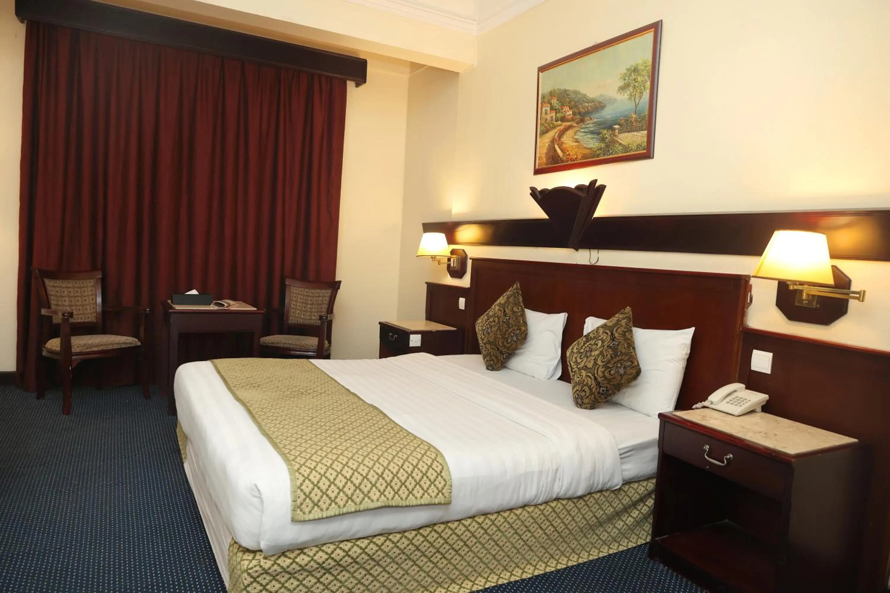 Bed in Claridge Hotel Dubai