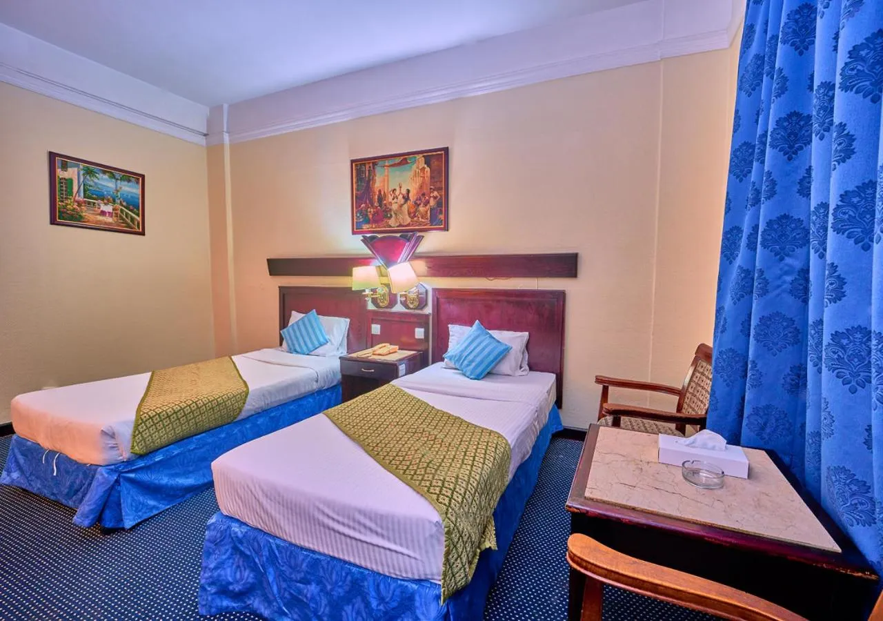 Bed in Claridge Hotel Dubai