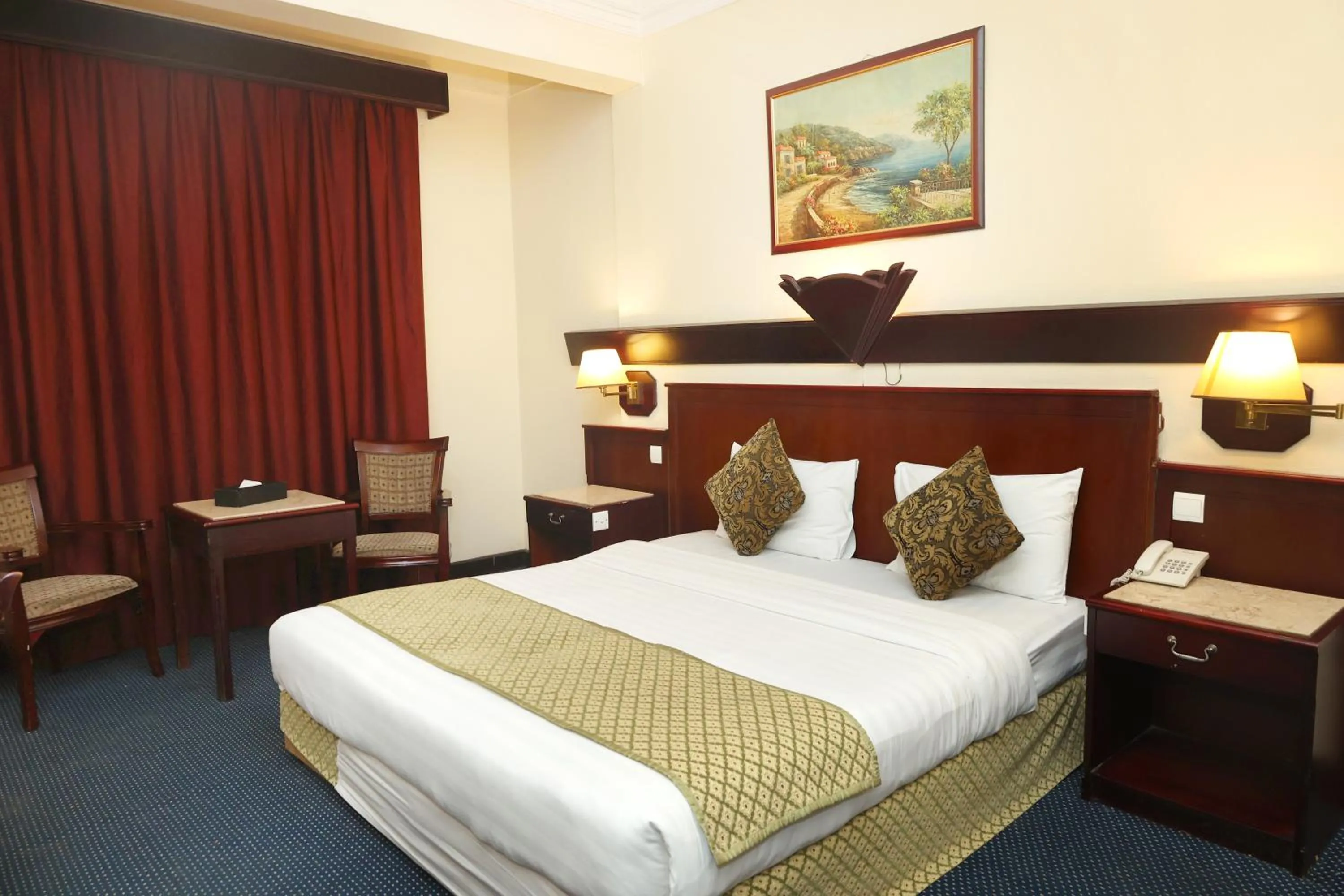 Bed in Claridge Hotel Dubai