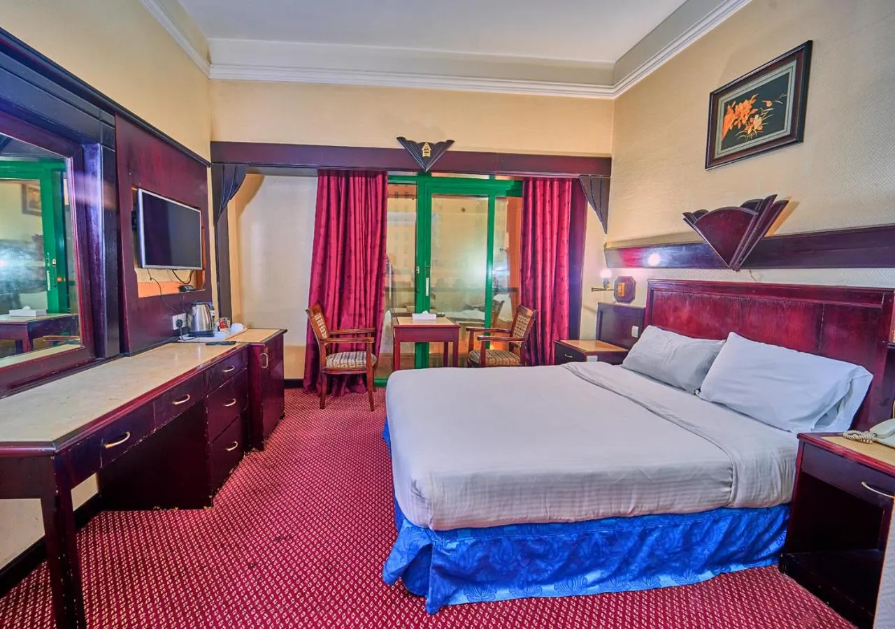 Bed in Claridge Hotel Dubai