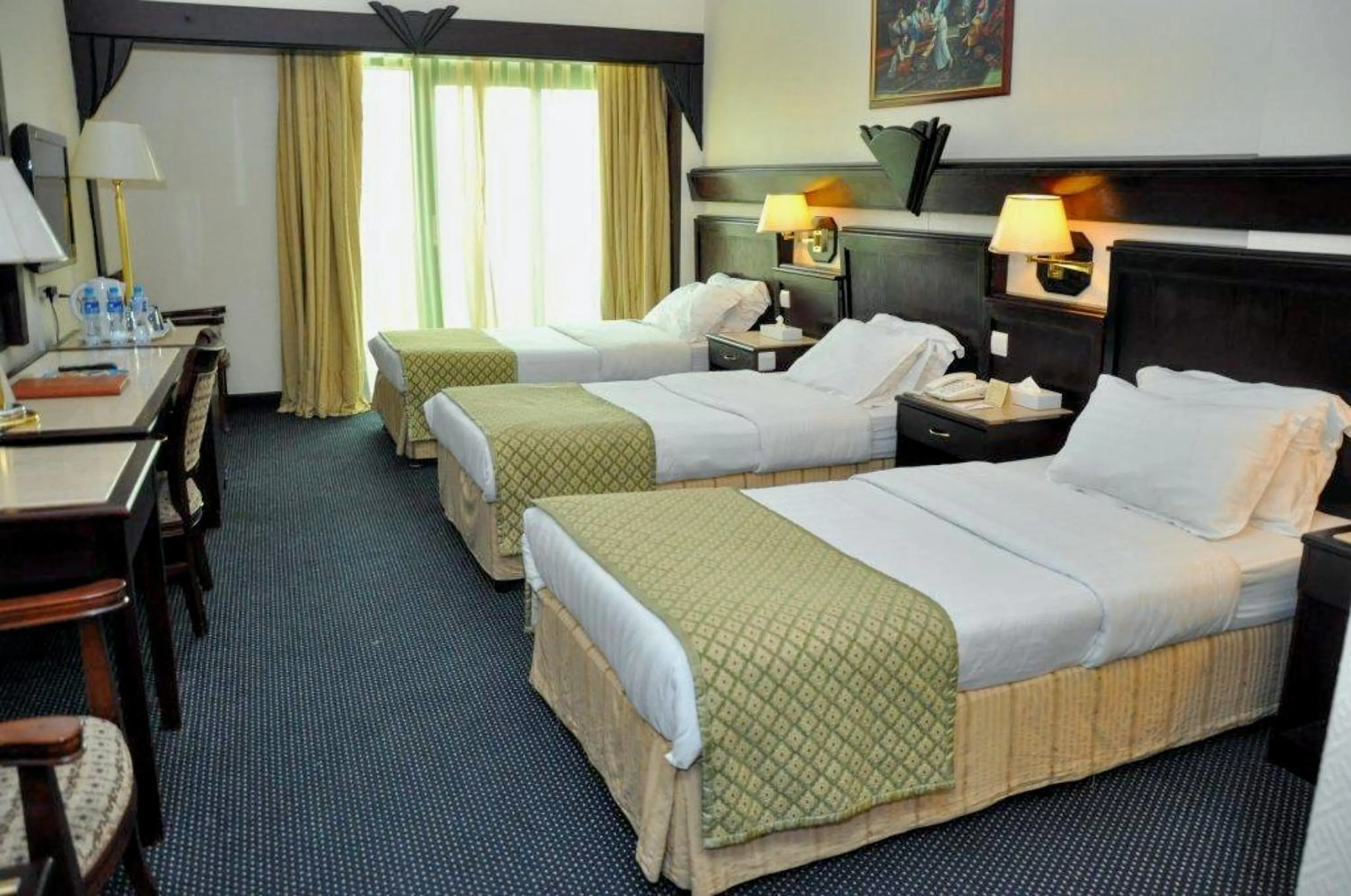 Bed in Claridge Hotel Dubai