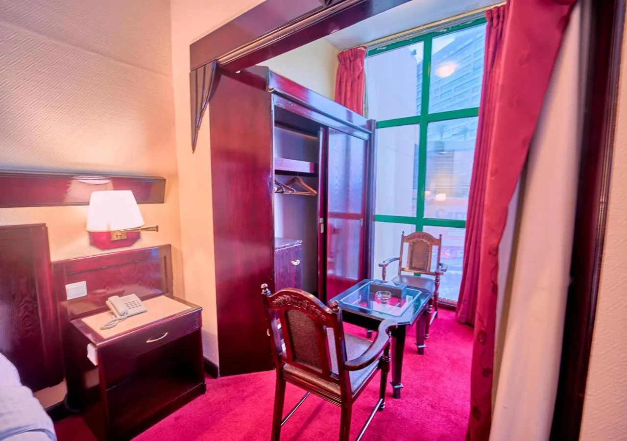 Seating area, Bed in Claridge Hotel Dubai