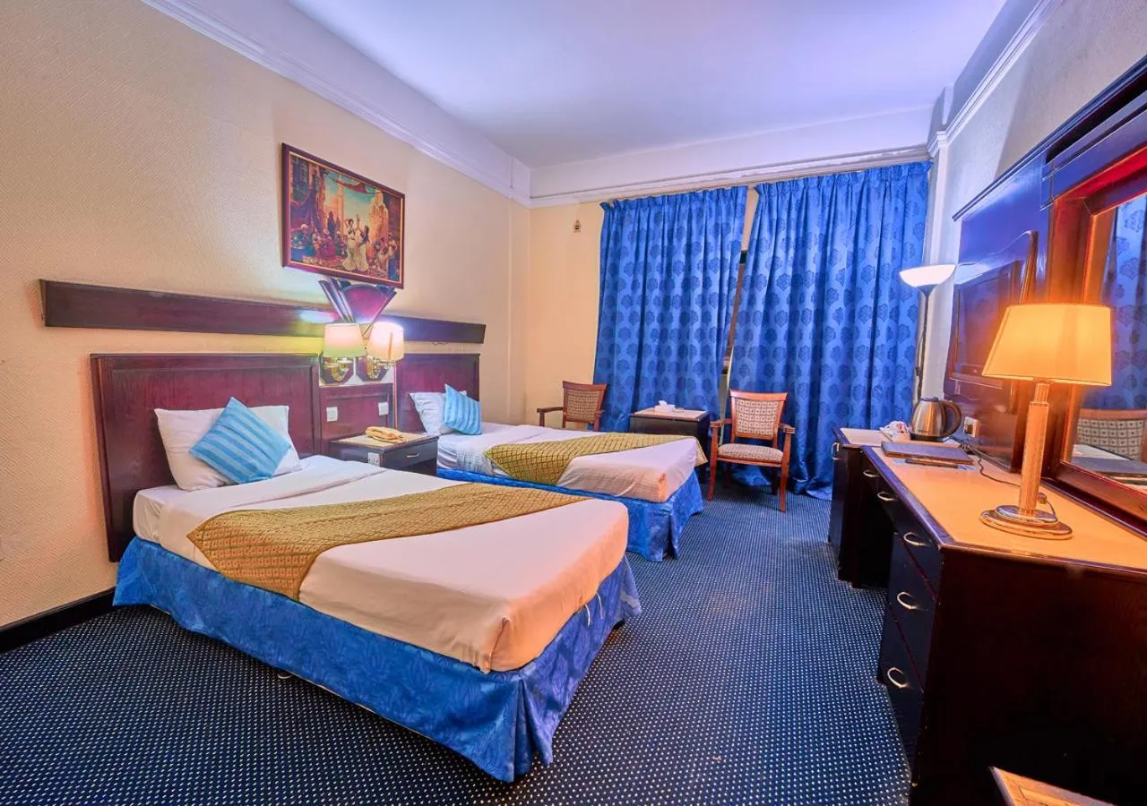 Bed in Claridge Hotel Dubai