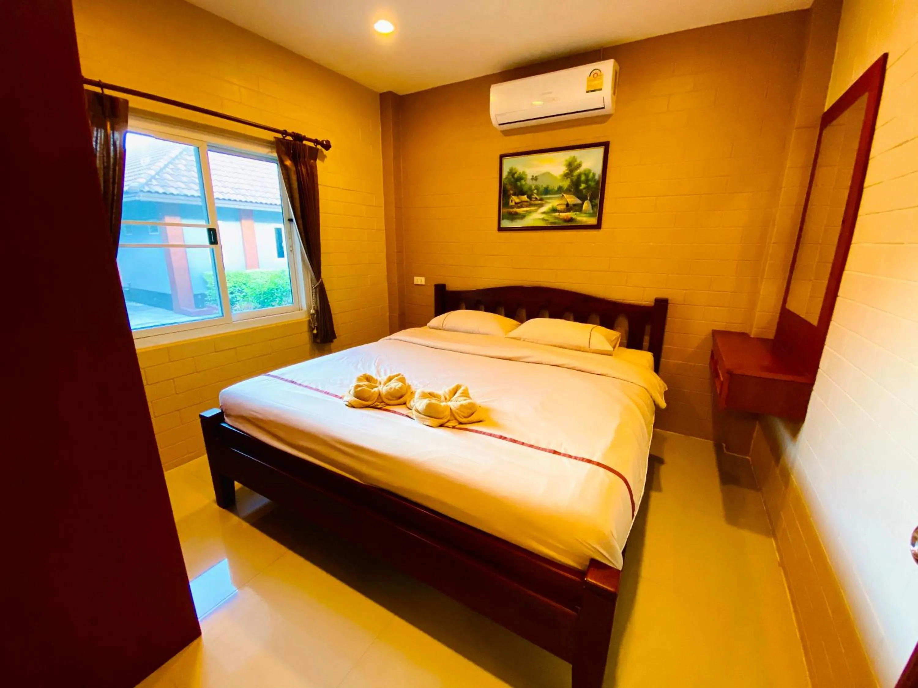 Bed in Benwadee Resort Pattaya
