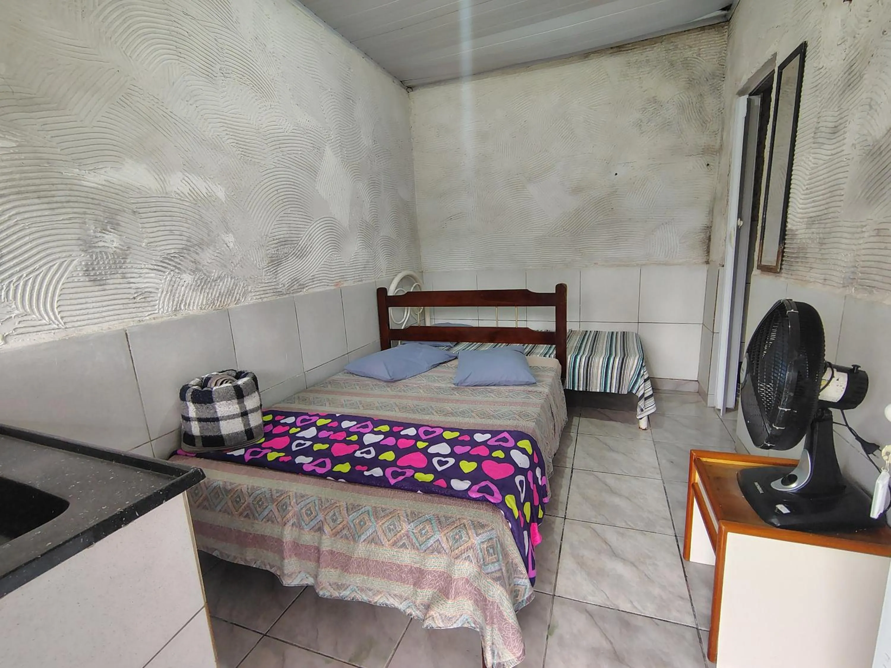 Bed in Pousada Lambaris Pereque Guarujá