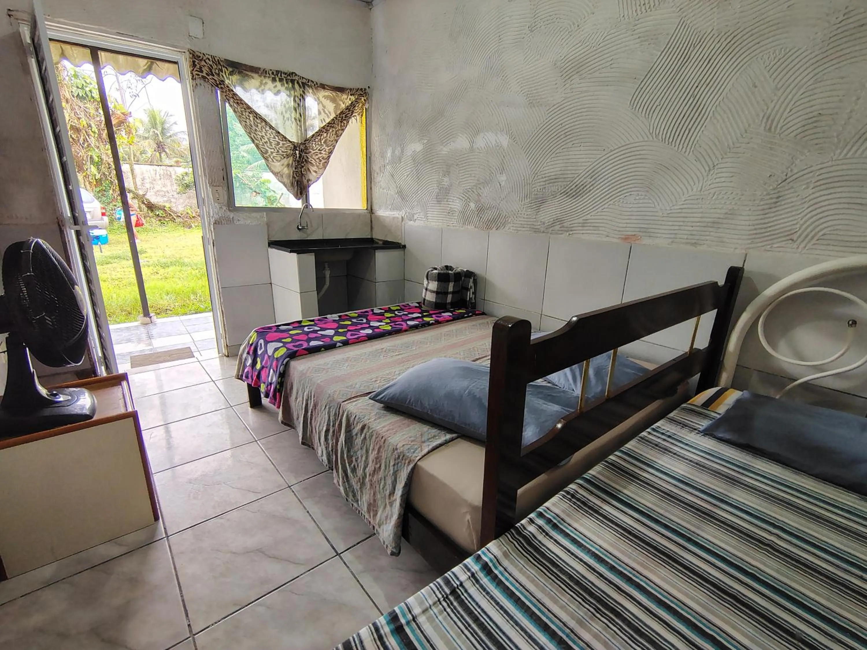 Bed in Pousada Lambaris Pereque Guarujá