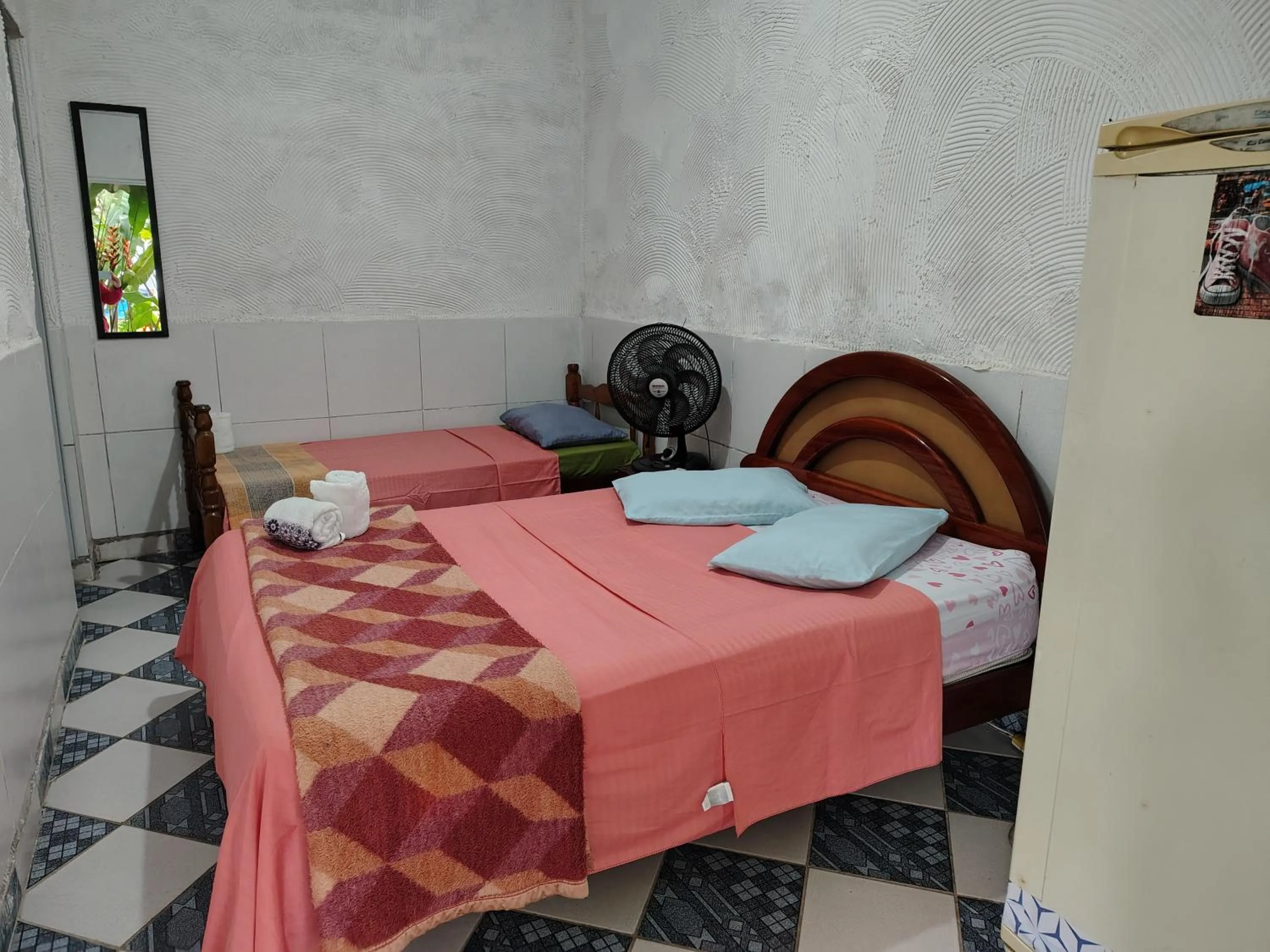 Bed in Pousada Lambaris Pereque Guarujá