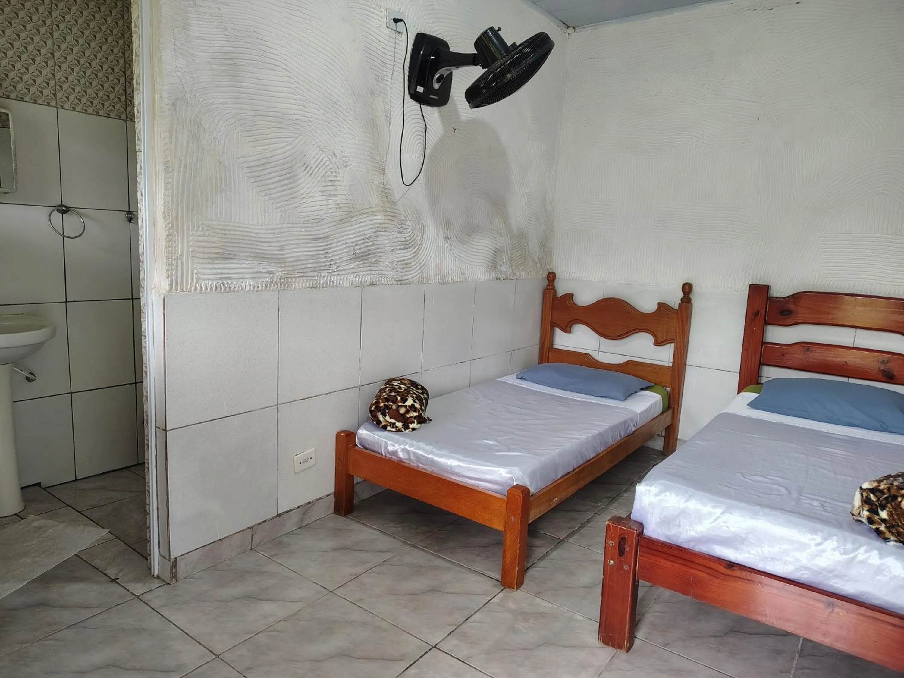 Bed in Pousada Lambaris Pereque Guarujá