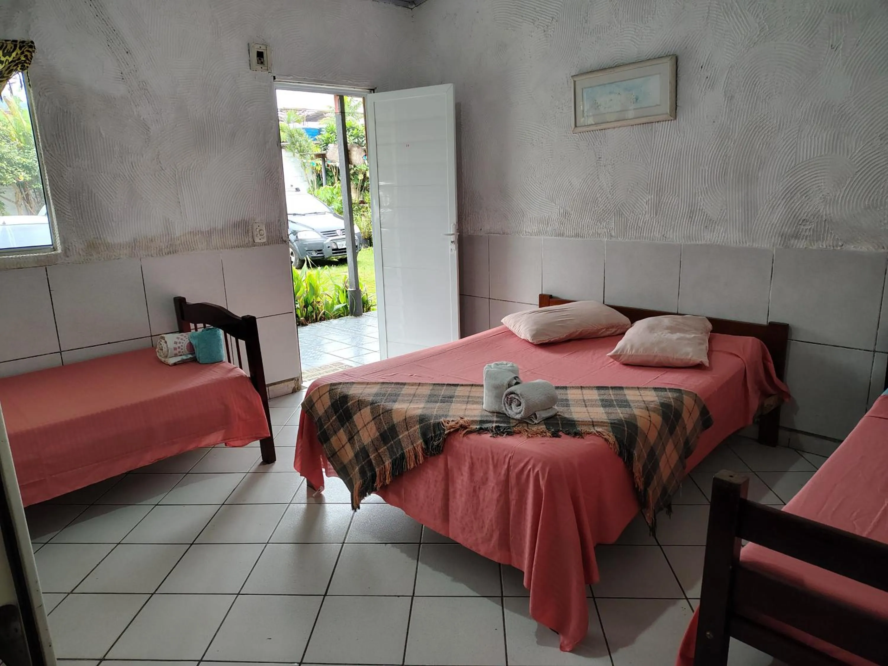 Bed in Pousada Lambaris Pereque Guarujá