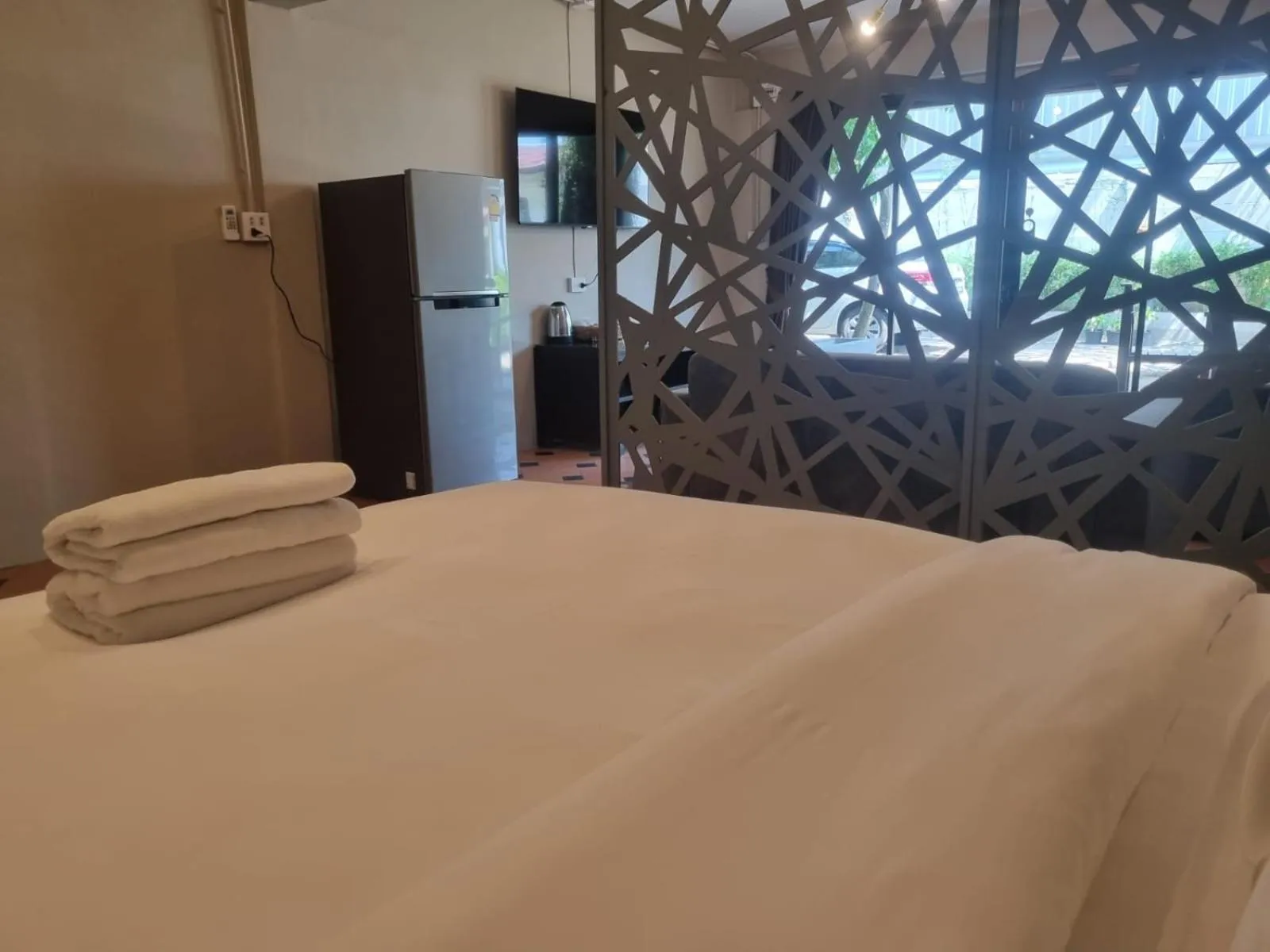 Bed in New Breakers Hotel Rawai