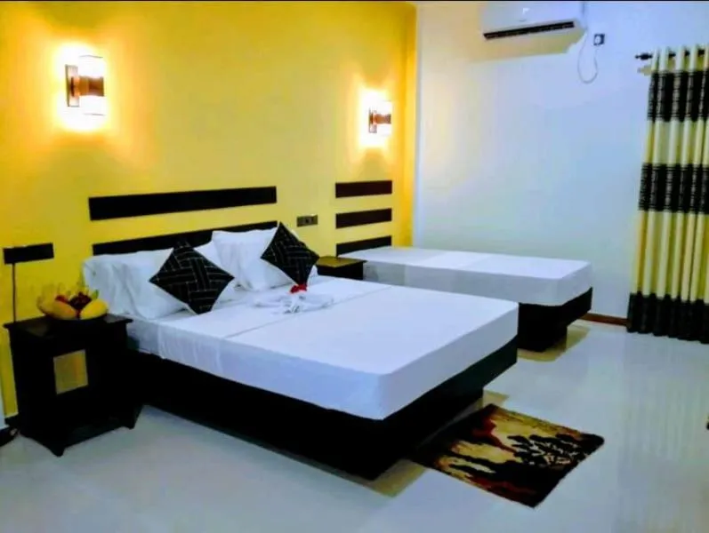 Bed in AMRON RESORT SIGIRIYA
