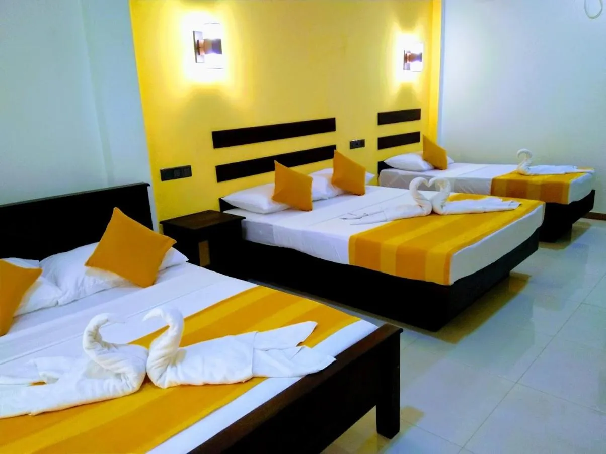 Bed in AMRON RESORT SIGIRIYA