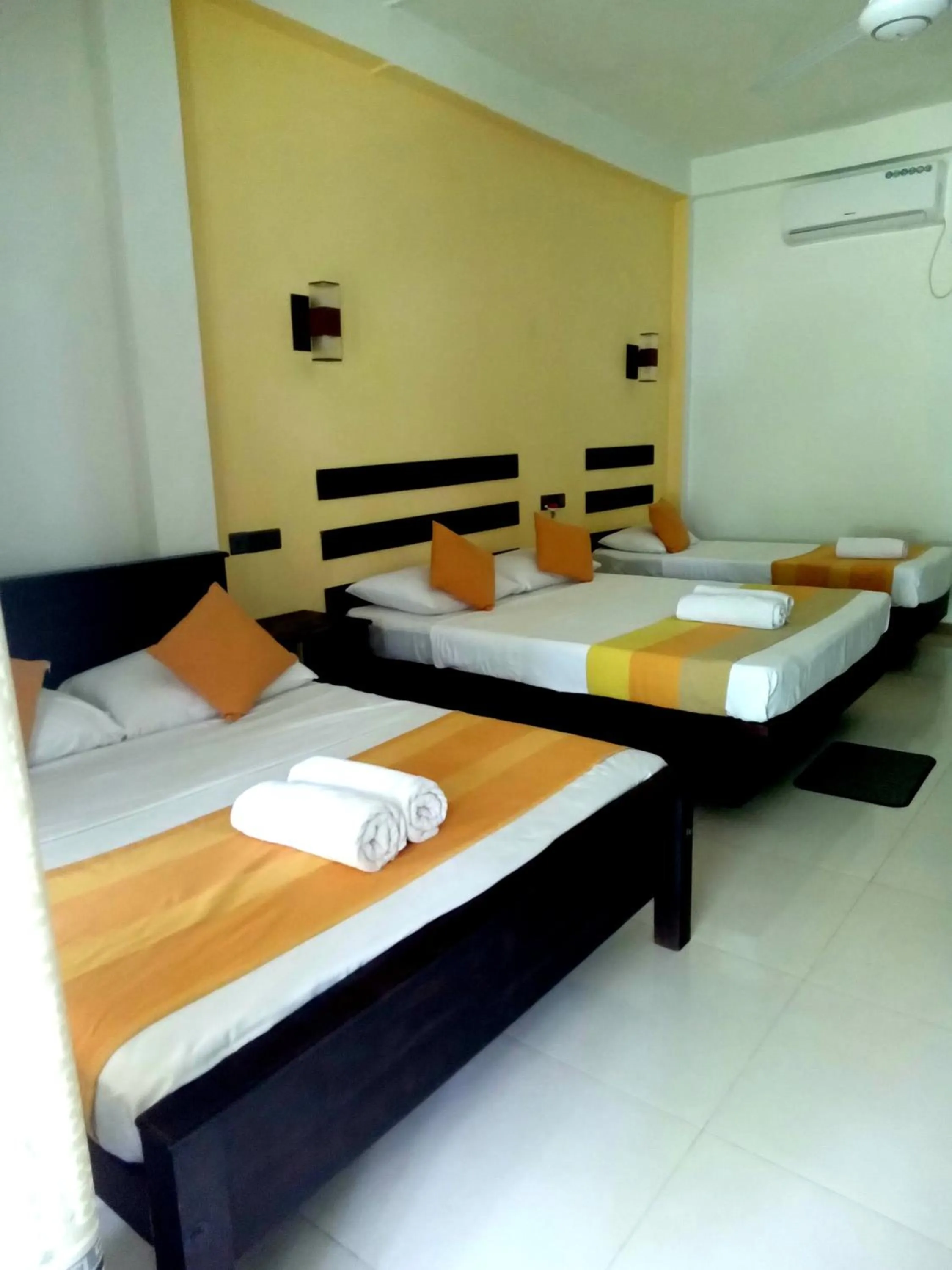 Bed in AMRON RESORT SIGIRIYA