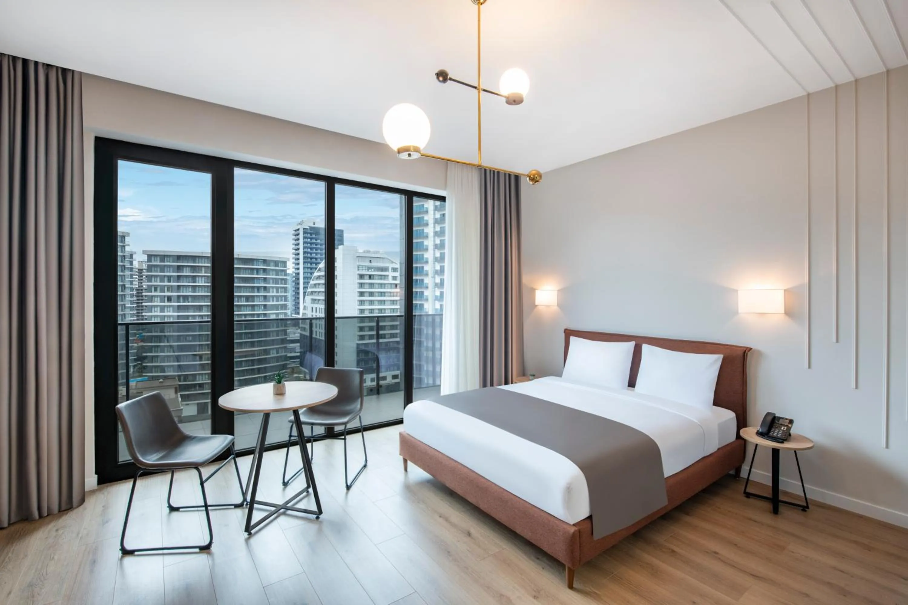 Living room, Bed in STEPS Batumi Hotel & Suites