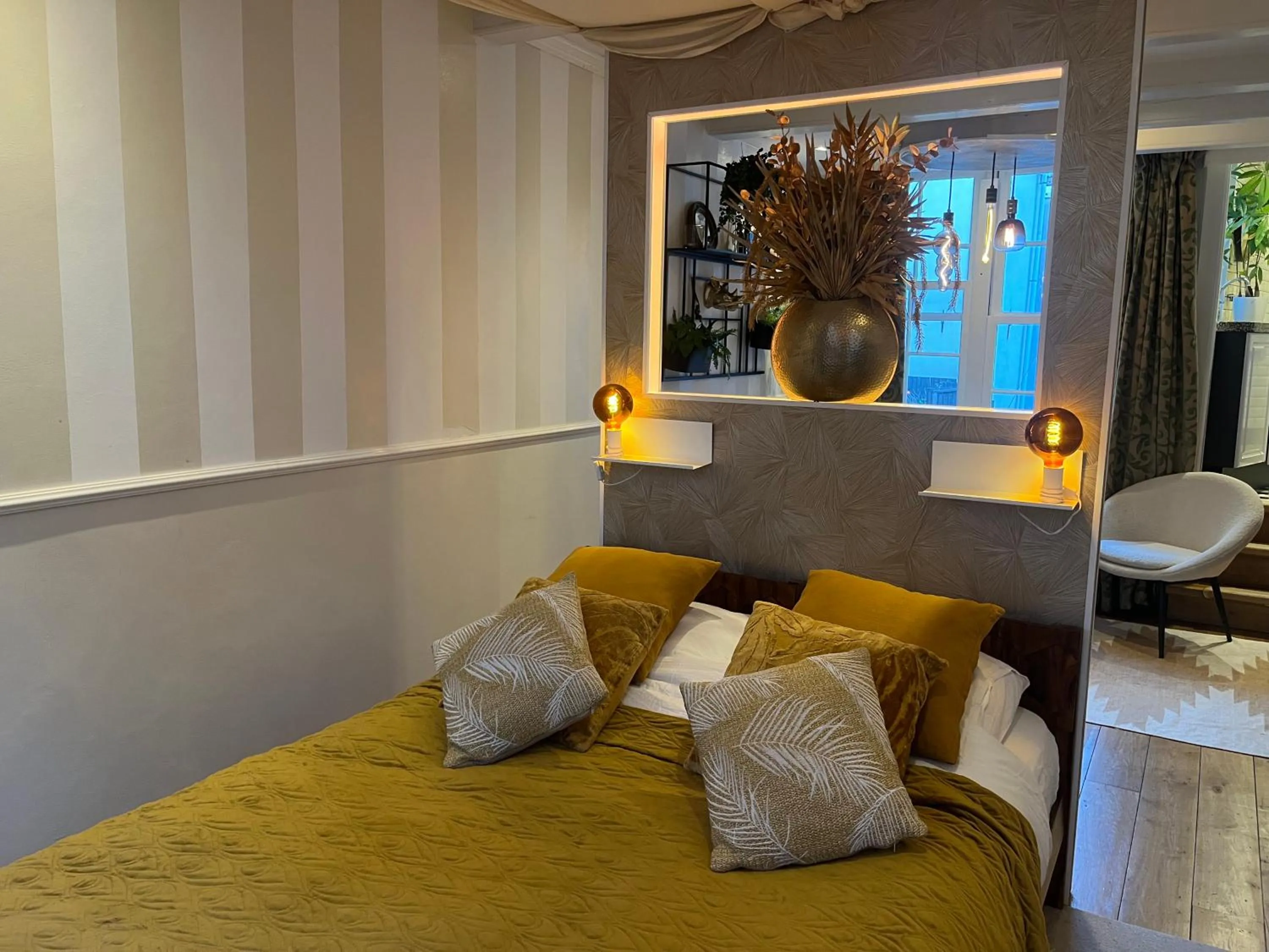 Bed in The Enlightened House Luxury Suites