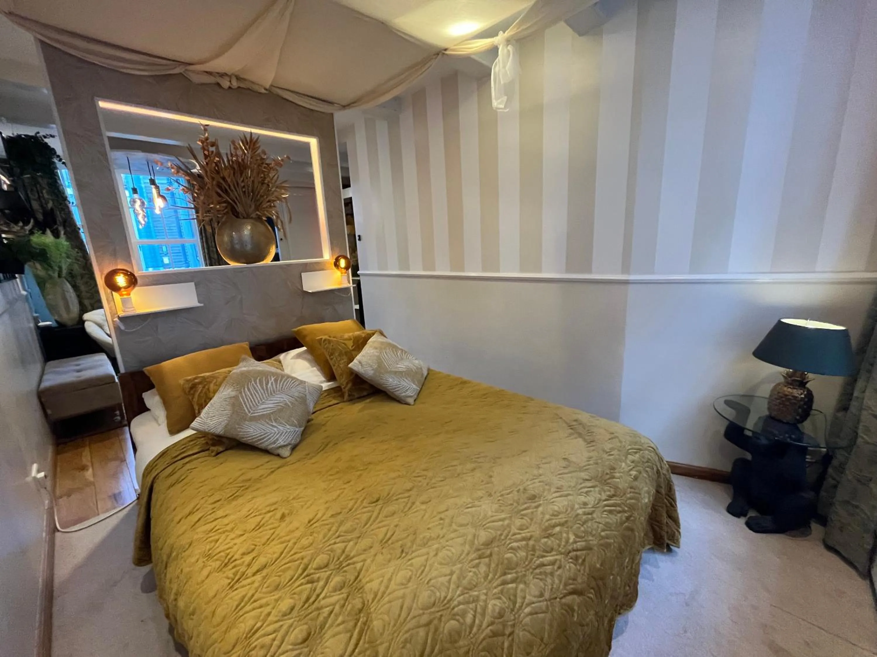 Bed in The Enlightened House Luxury Suites