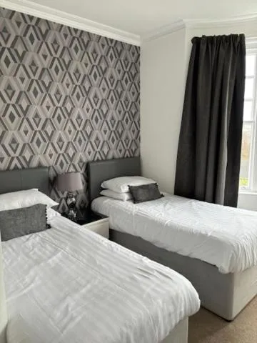 Bed in The Sandpiper Guest House