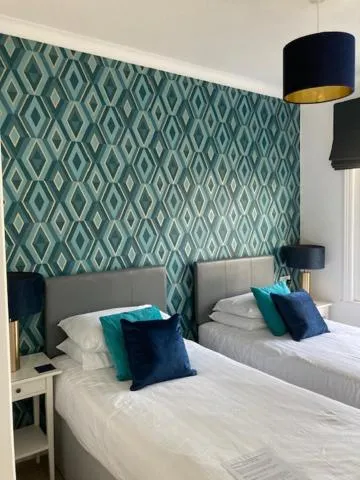 Bed in The Sandpiper Guest House