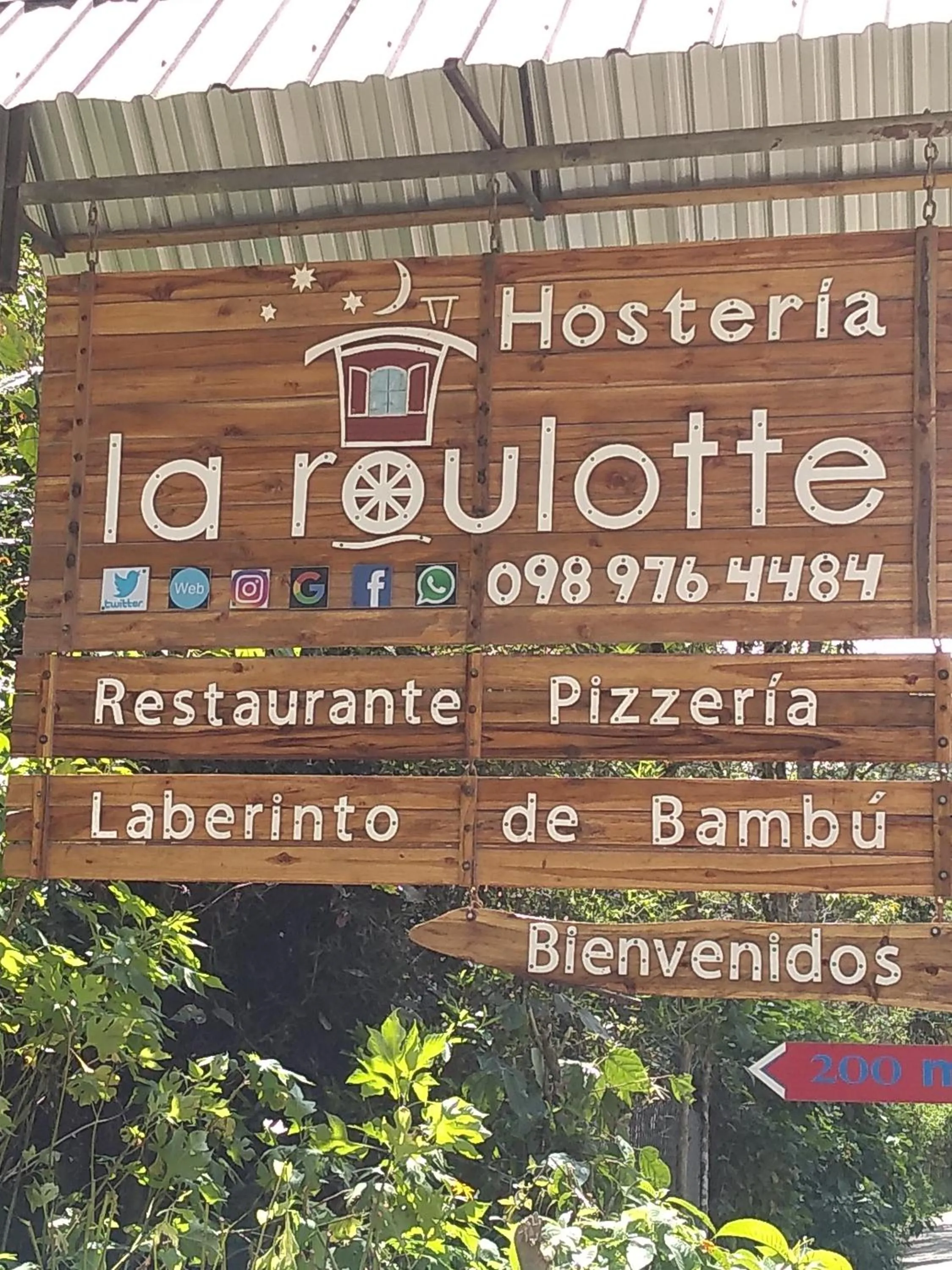 Property logo or sign in Hosteria La Roulotte - Mindo