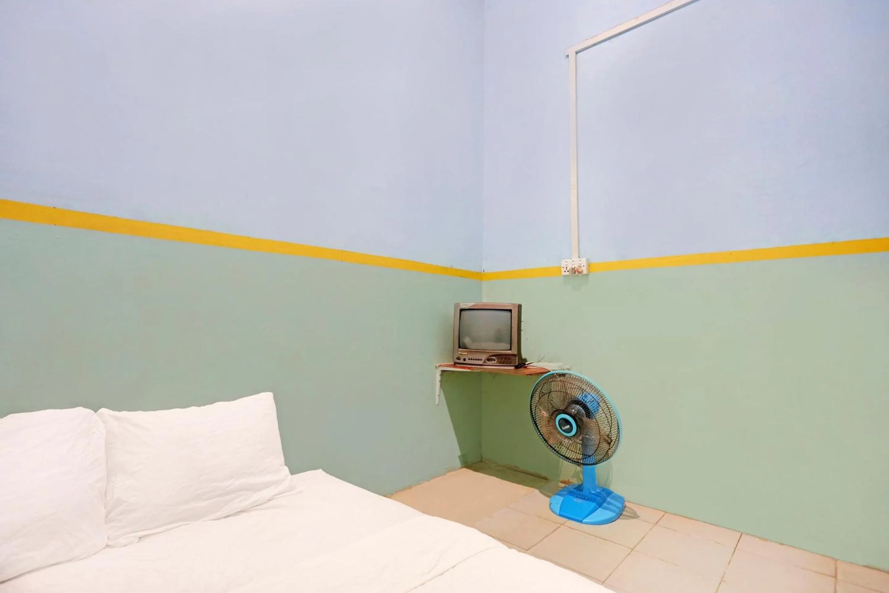 Bedroom in Hotel O Toyo Homestay Syariah