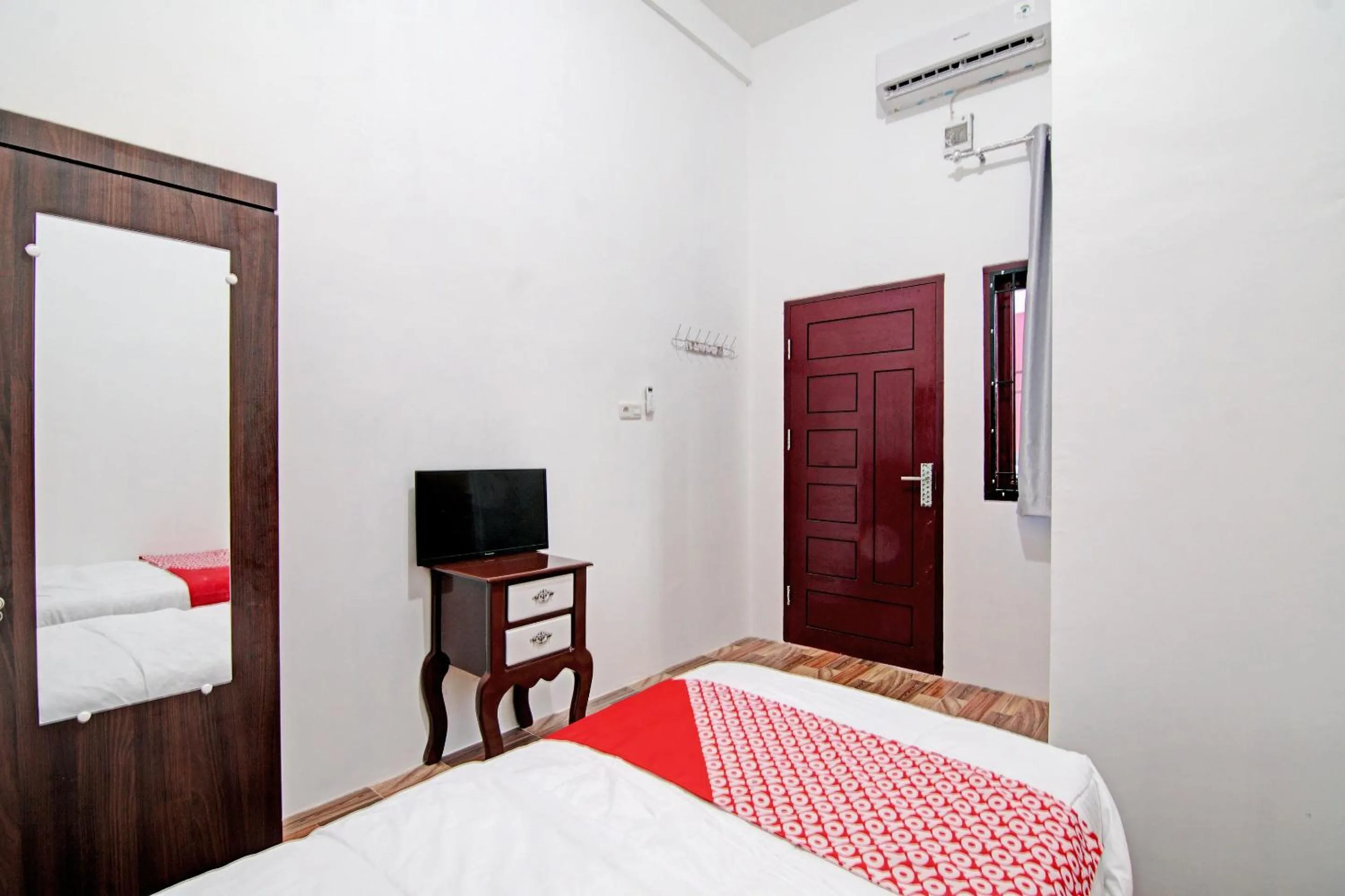Bedroom in OYO 92946 Dekna Homestay Syariah