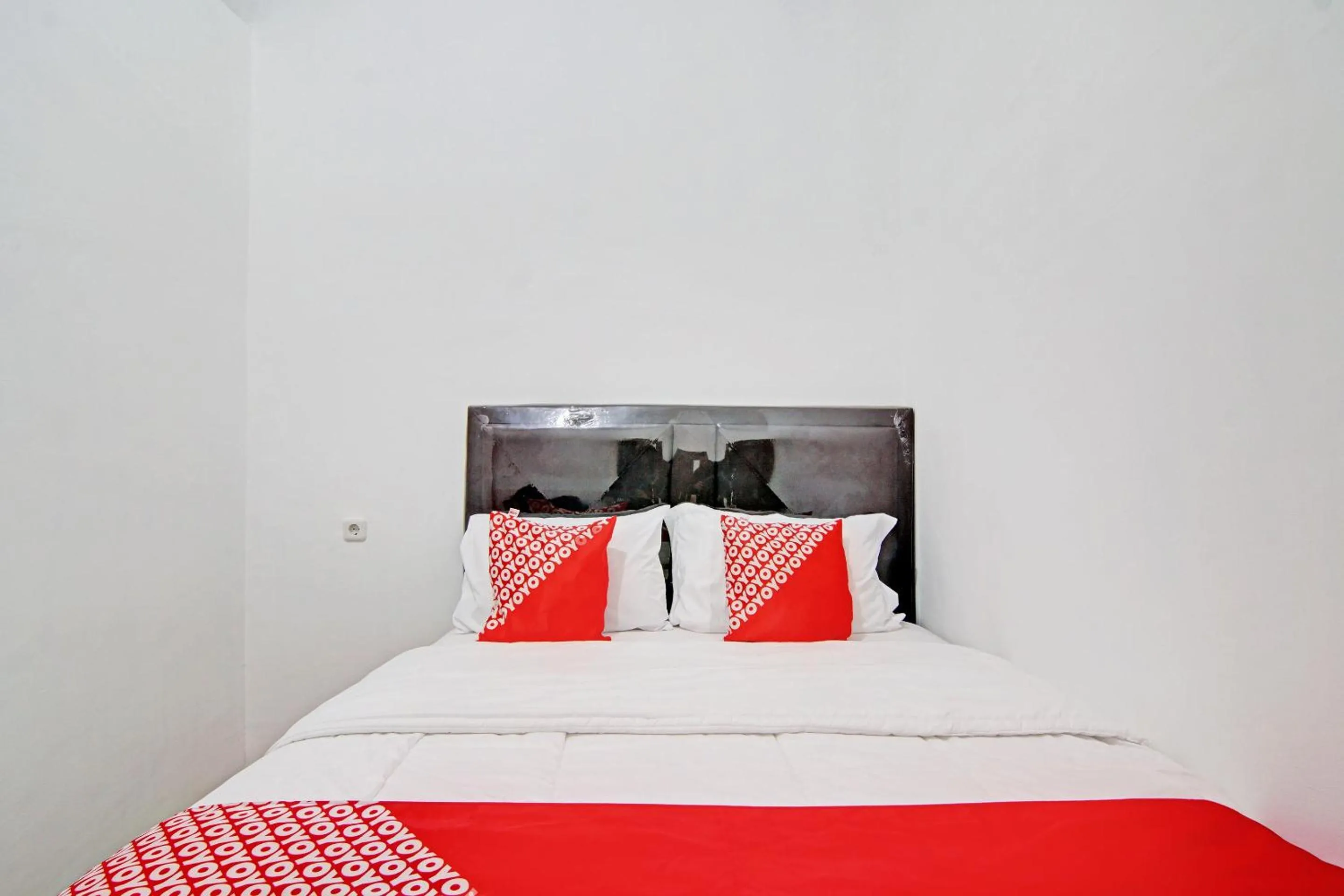 Bedroom in OYO 92946 Dekna Homestay Syariah