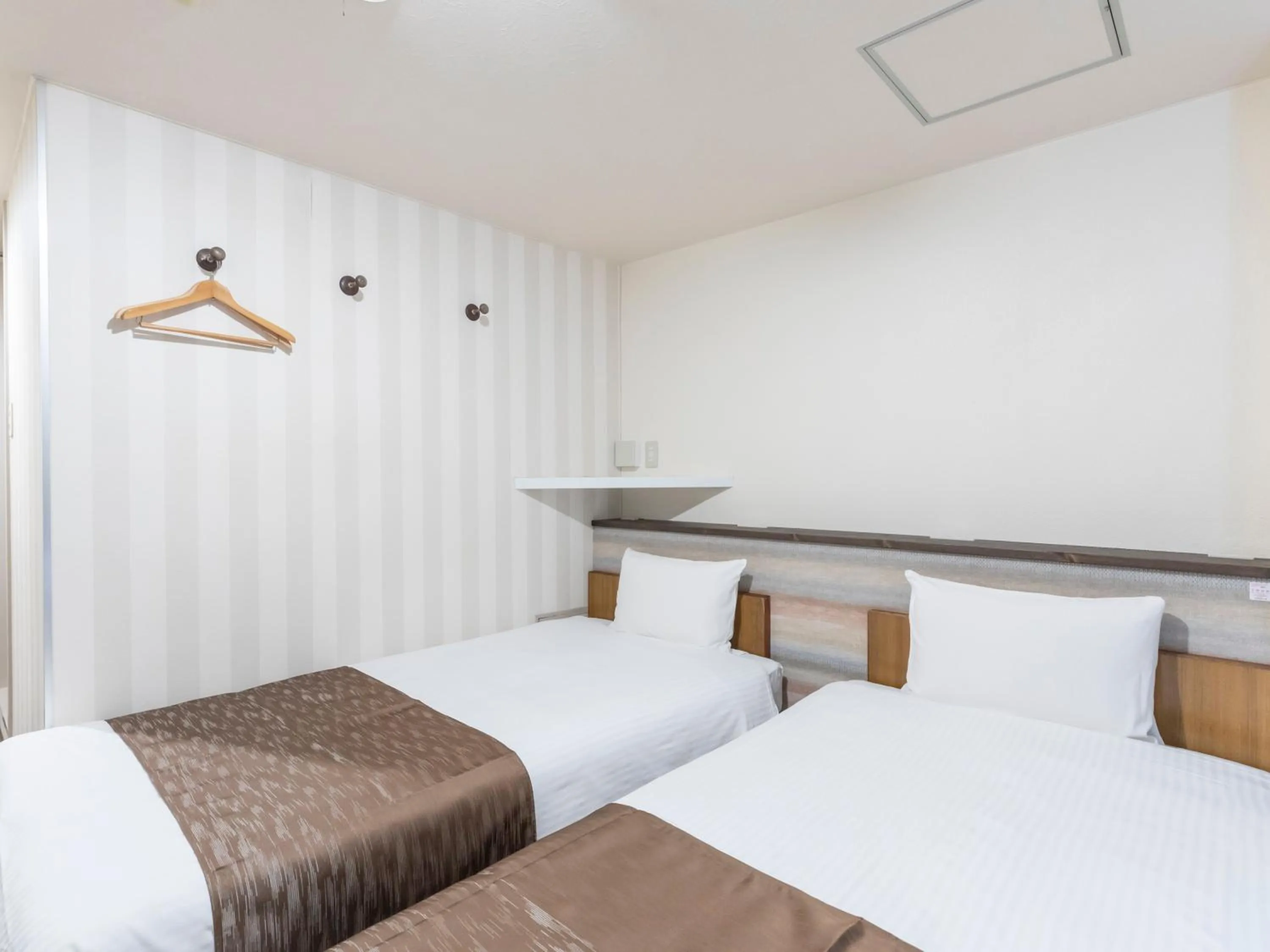 Photo of the whole room, Bed in Tabist New Gekkoen