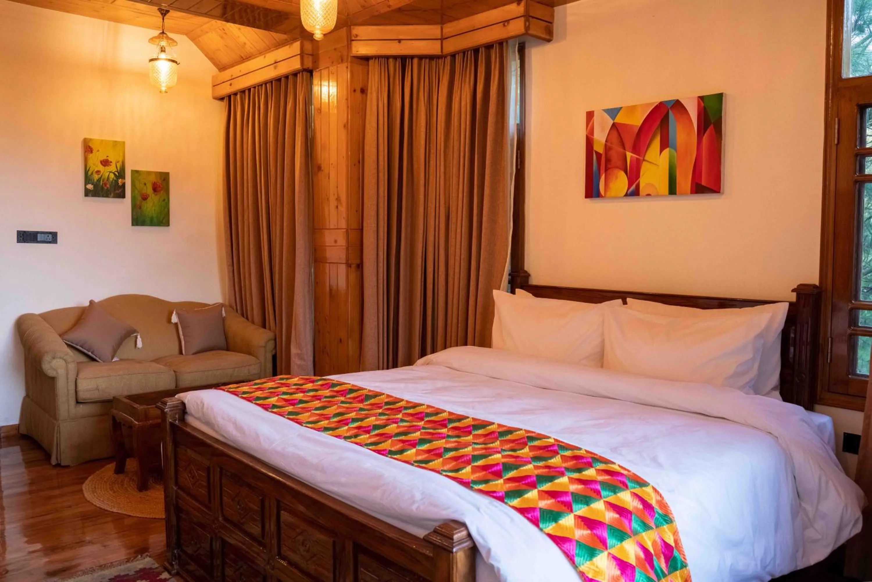 Seating area, Bed in Chillaru Spa & Resort