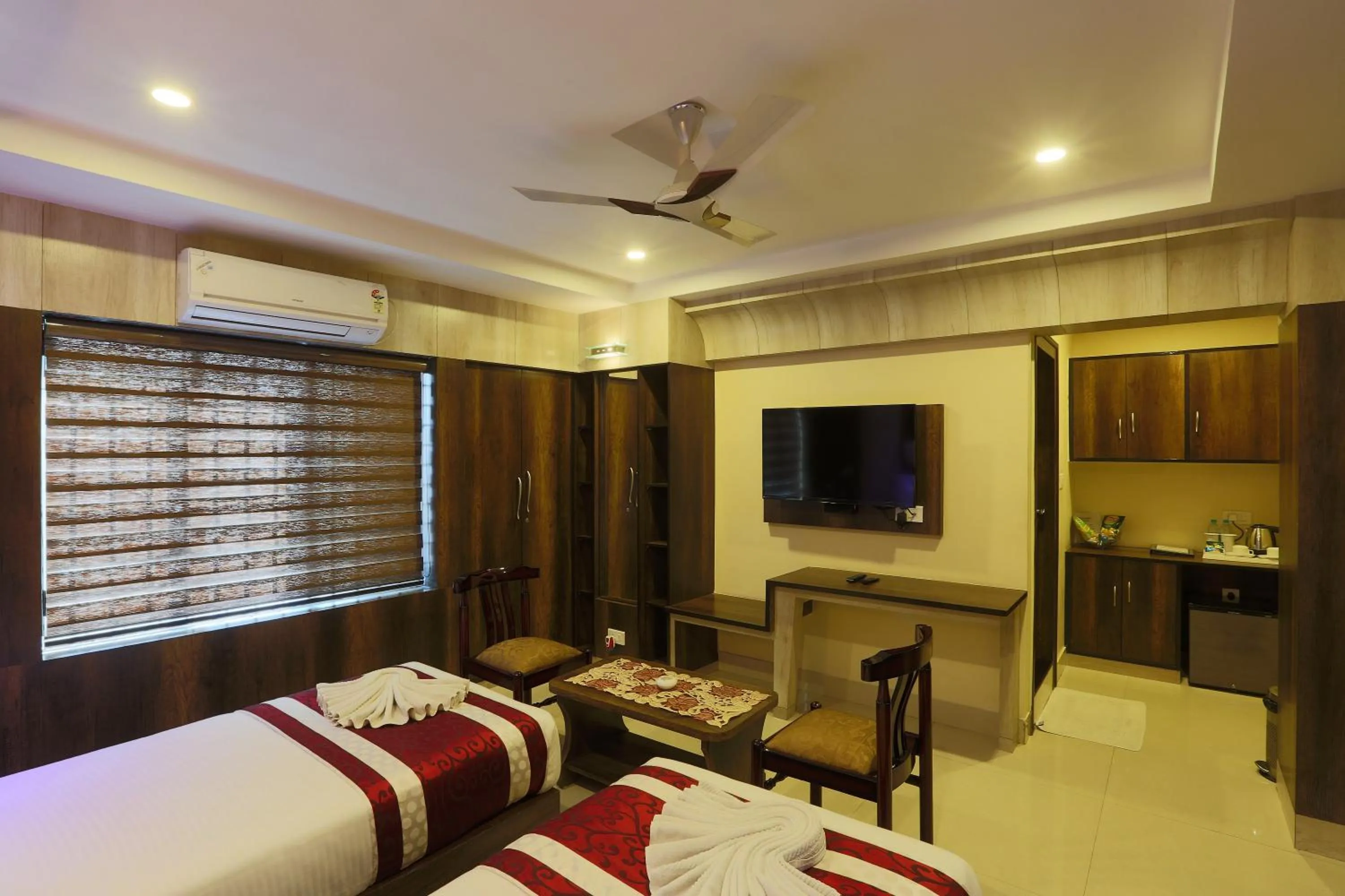 Communal lounge/ TV room, Bed in Hotel Blue Bird, Nagaon