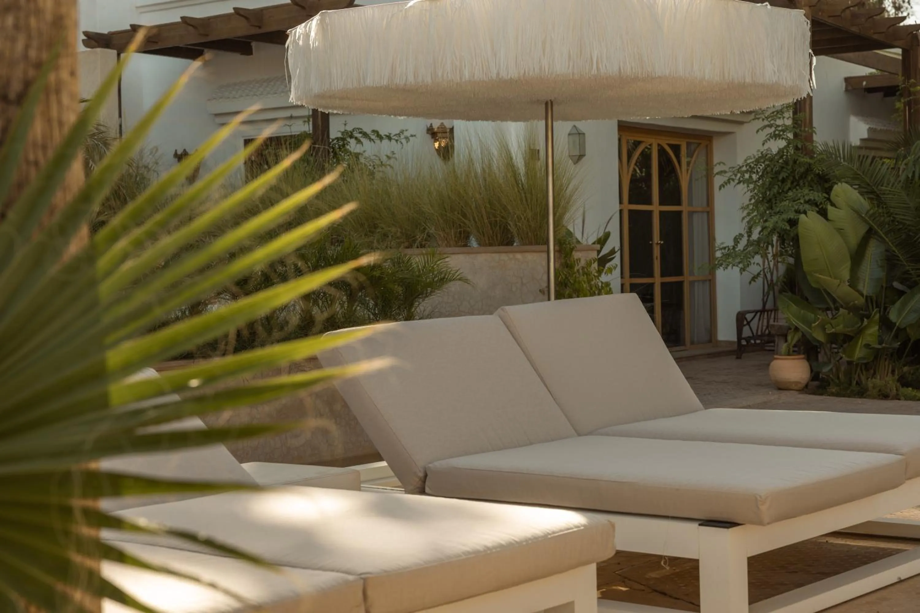 Swimming pool in Les Palmiers Boutique Hôtel & Spa