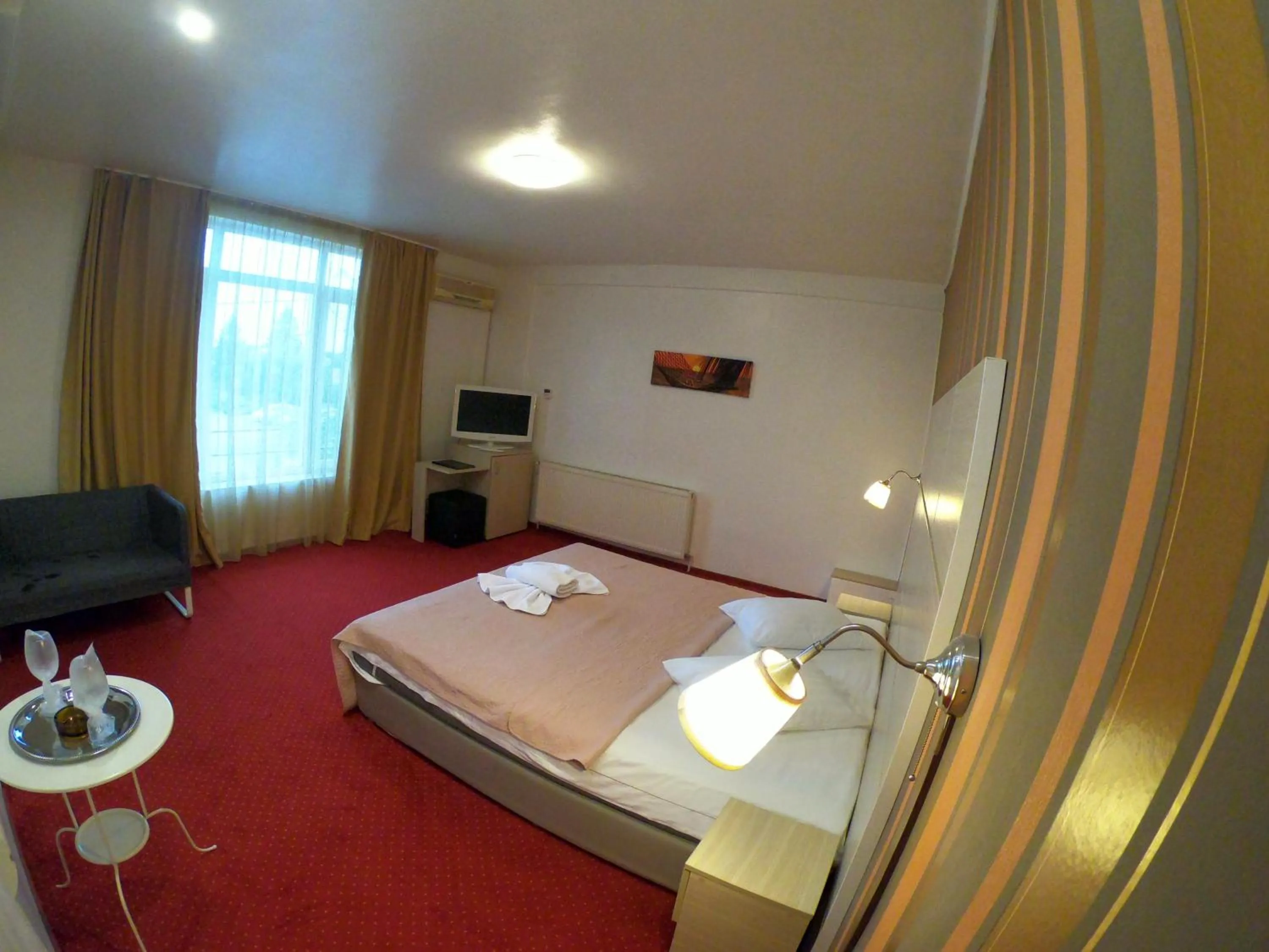 Bed in Hotel Mon Caprice