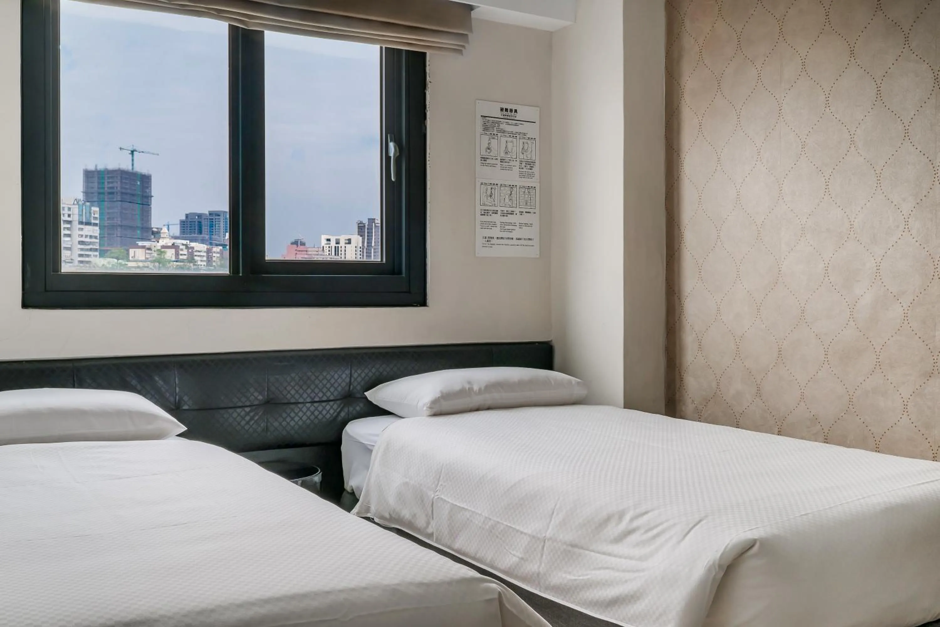 Bed in CHECK inn Express Kaohsiung Love River