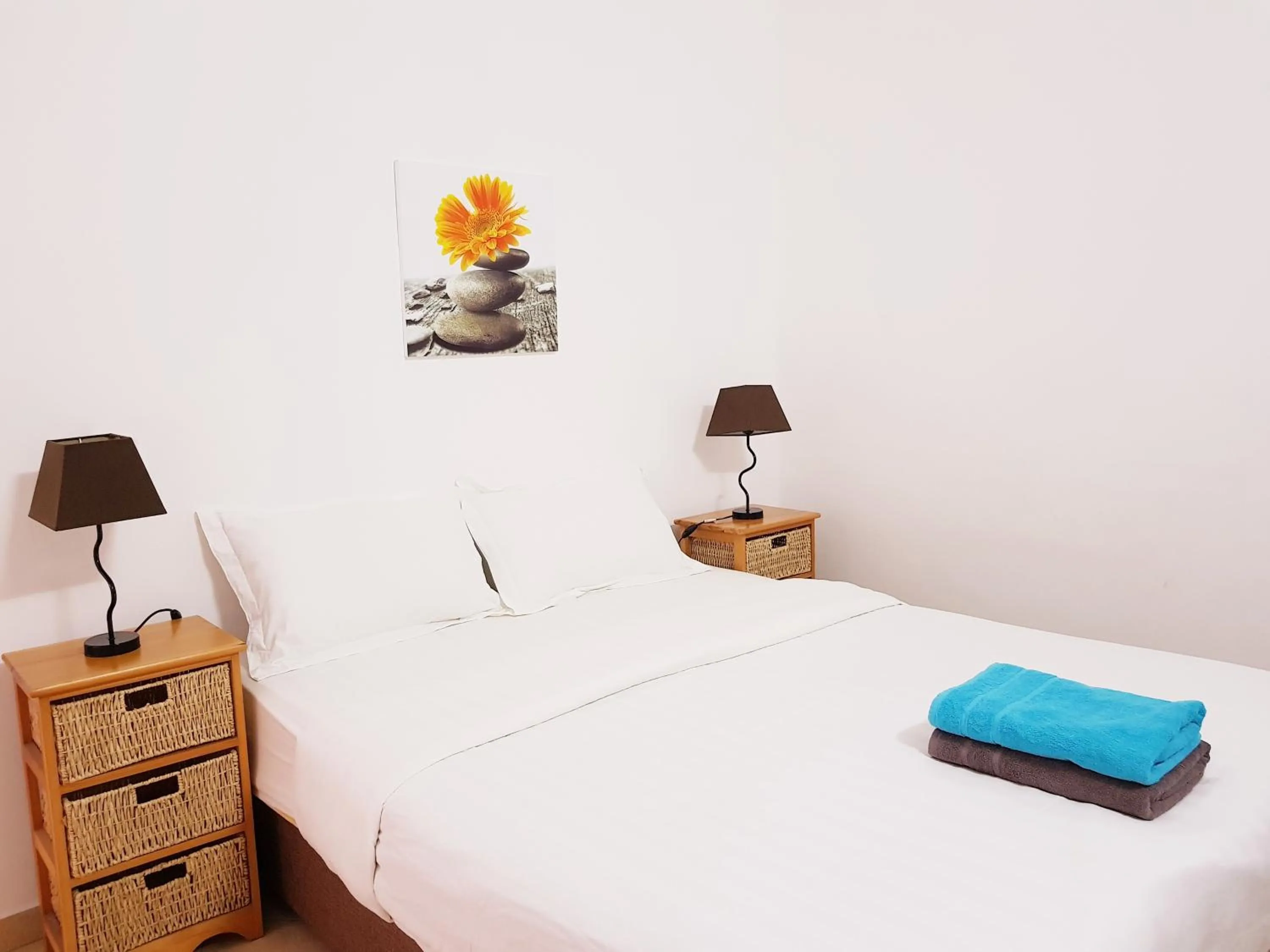 Bed in La Perla Holiday Apartments