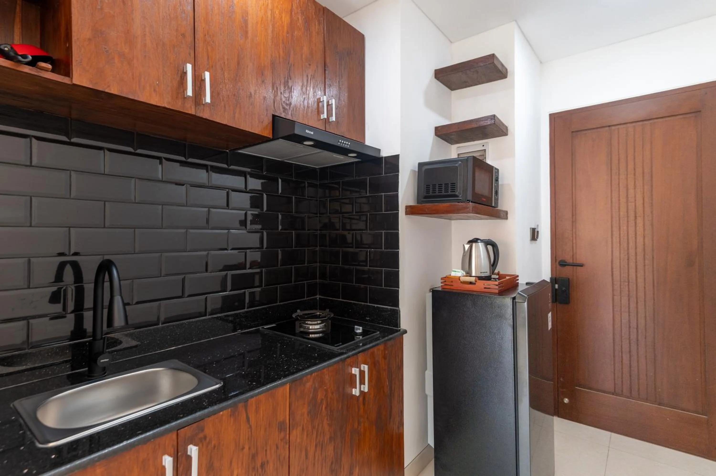 Kitchen or kitchenette in Griya Shanti Suites