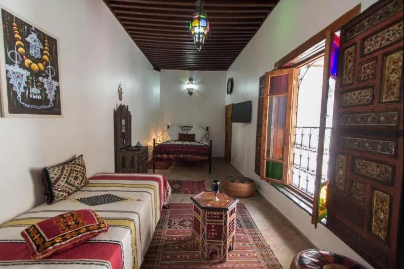 Bed in Riad Sanaa Rose