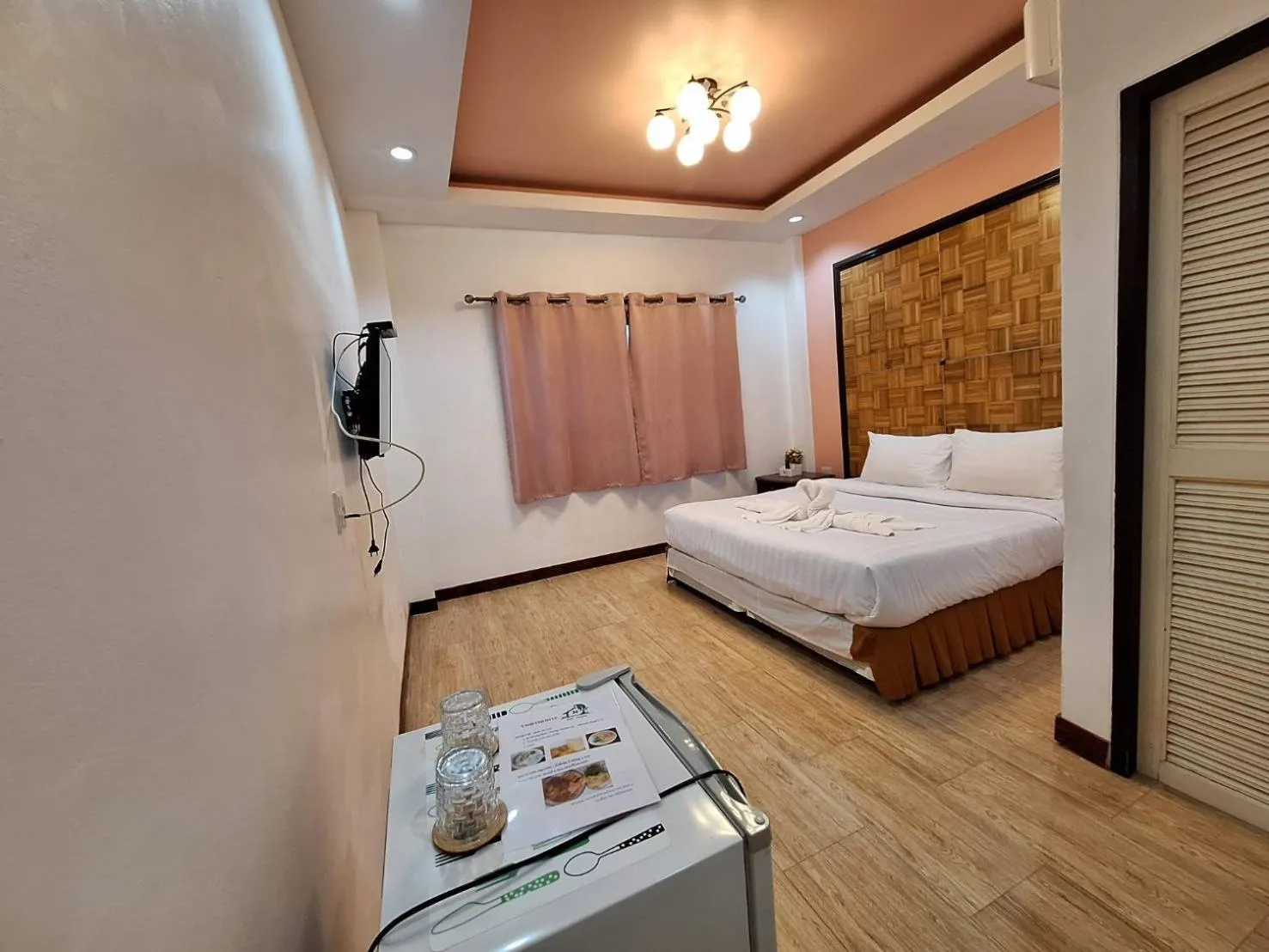 Bed in Kan Home Hotel