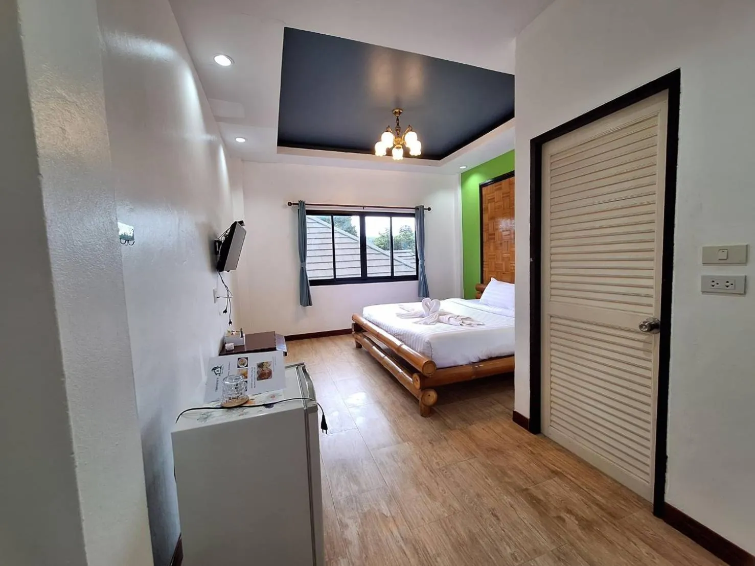 Bed in Kan Home Hotel