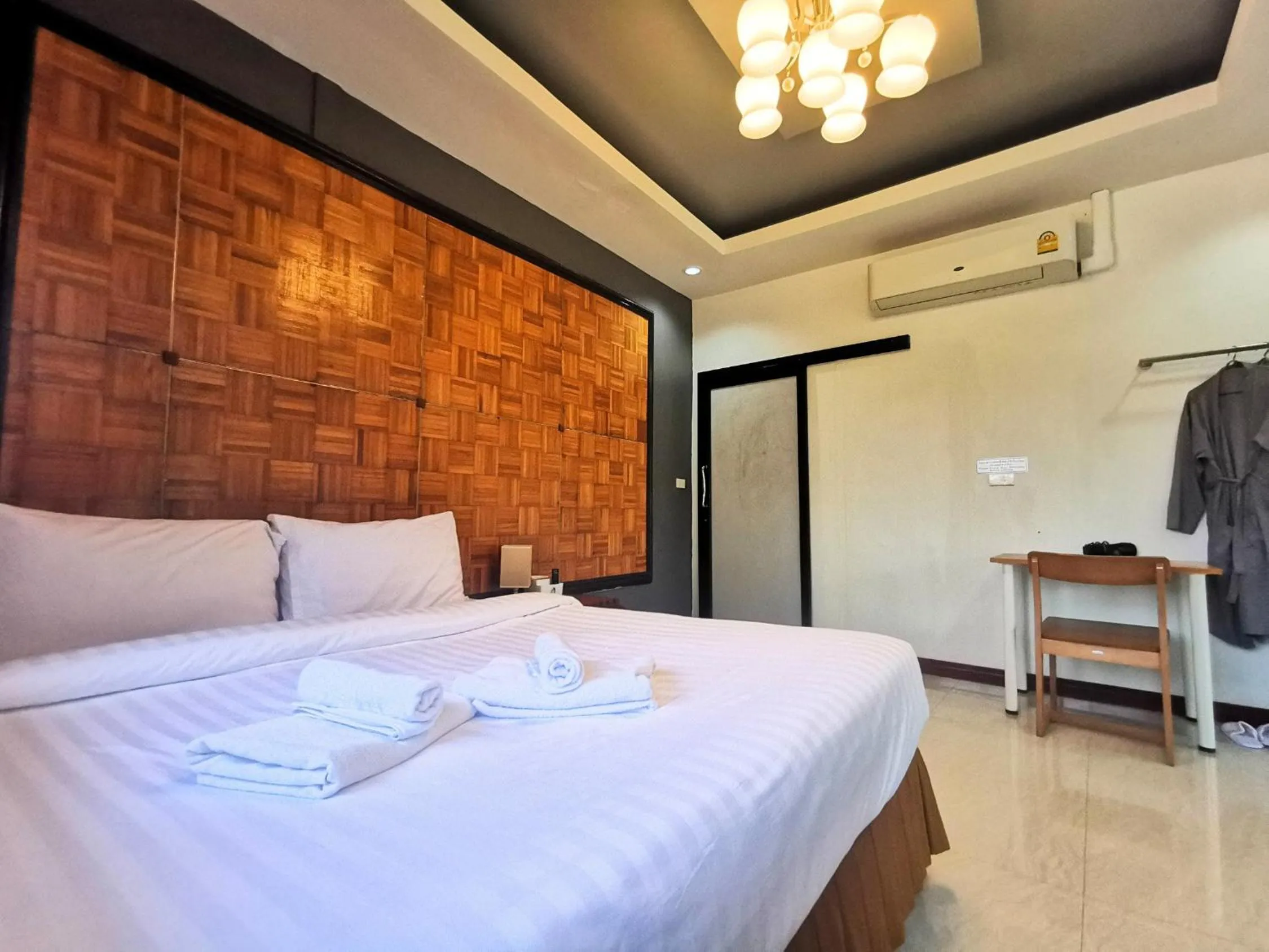 Bed in Kan Home Hotel