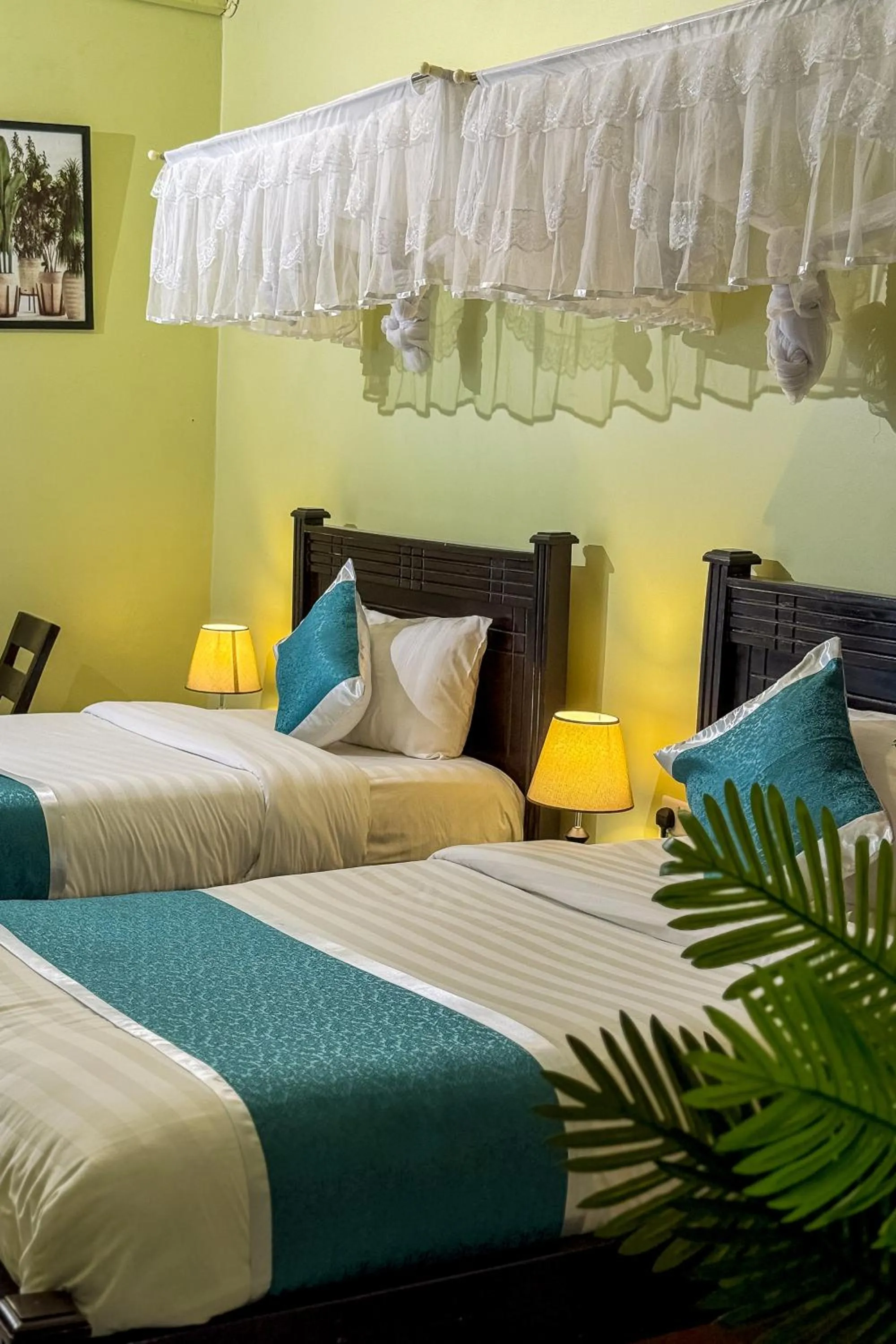 Bed in BWIRANDA HOTEL