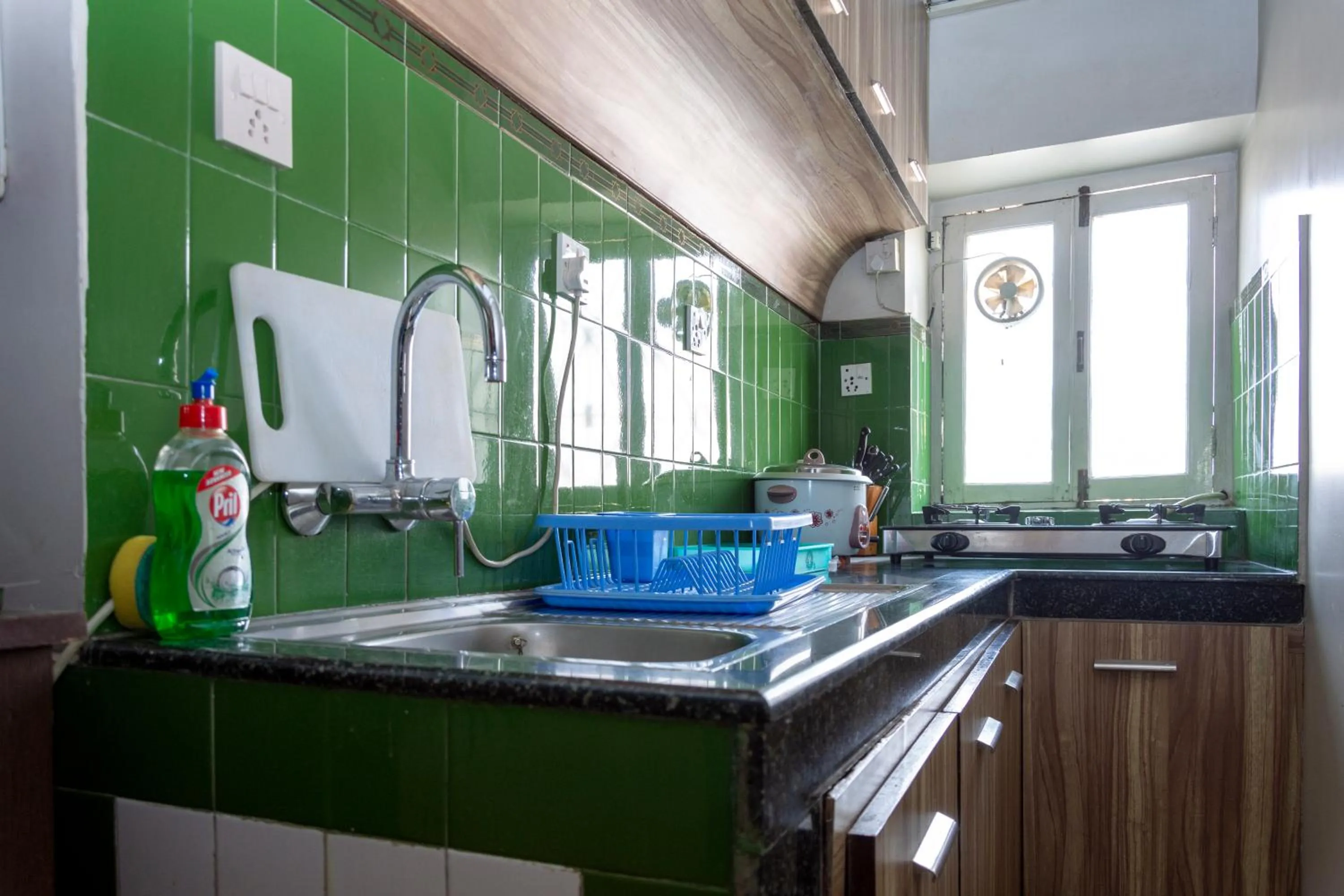 Kitchen or kitchenette in Shaligram Hotel