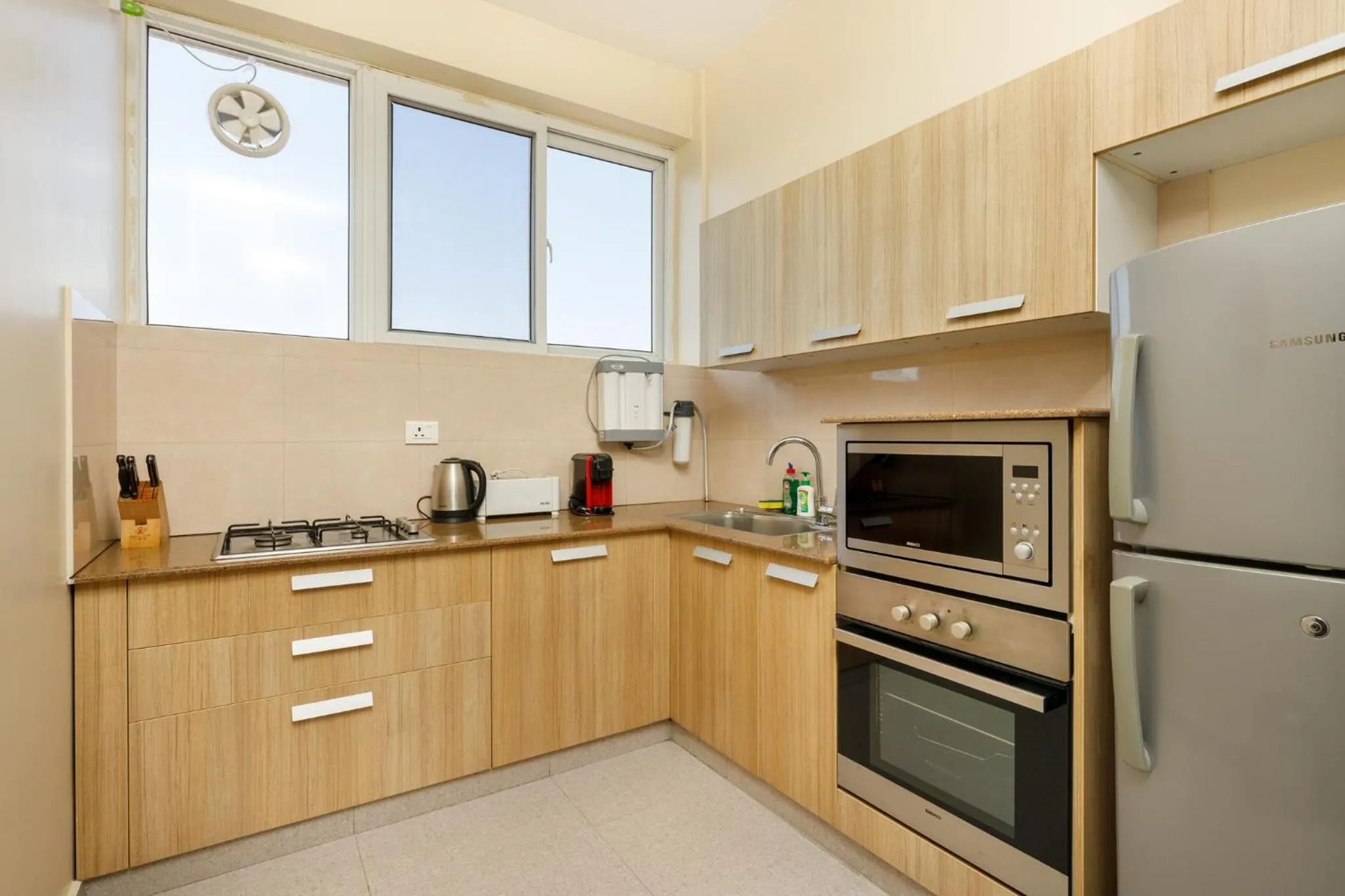 Kitchen or kitchenette in Shaligram Hotel