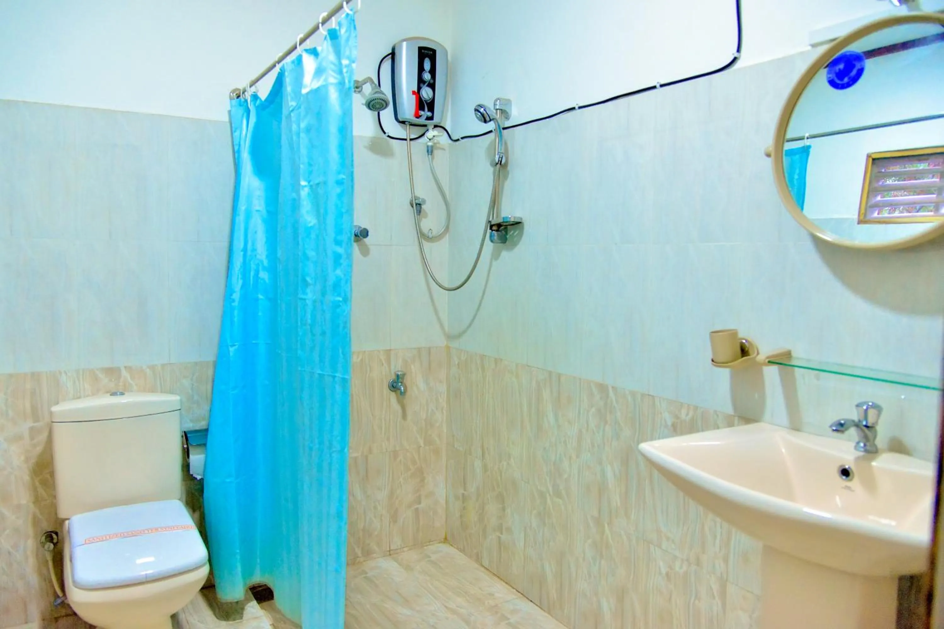 Shower in Thilaka City Hotel
