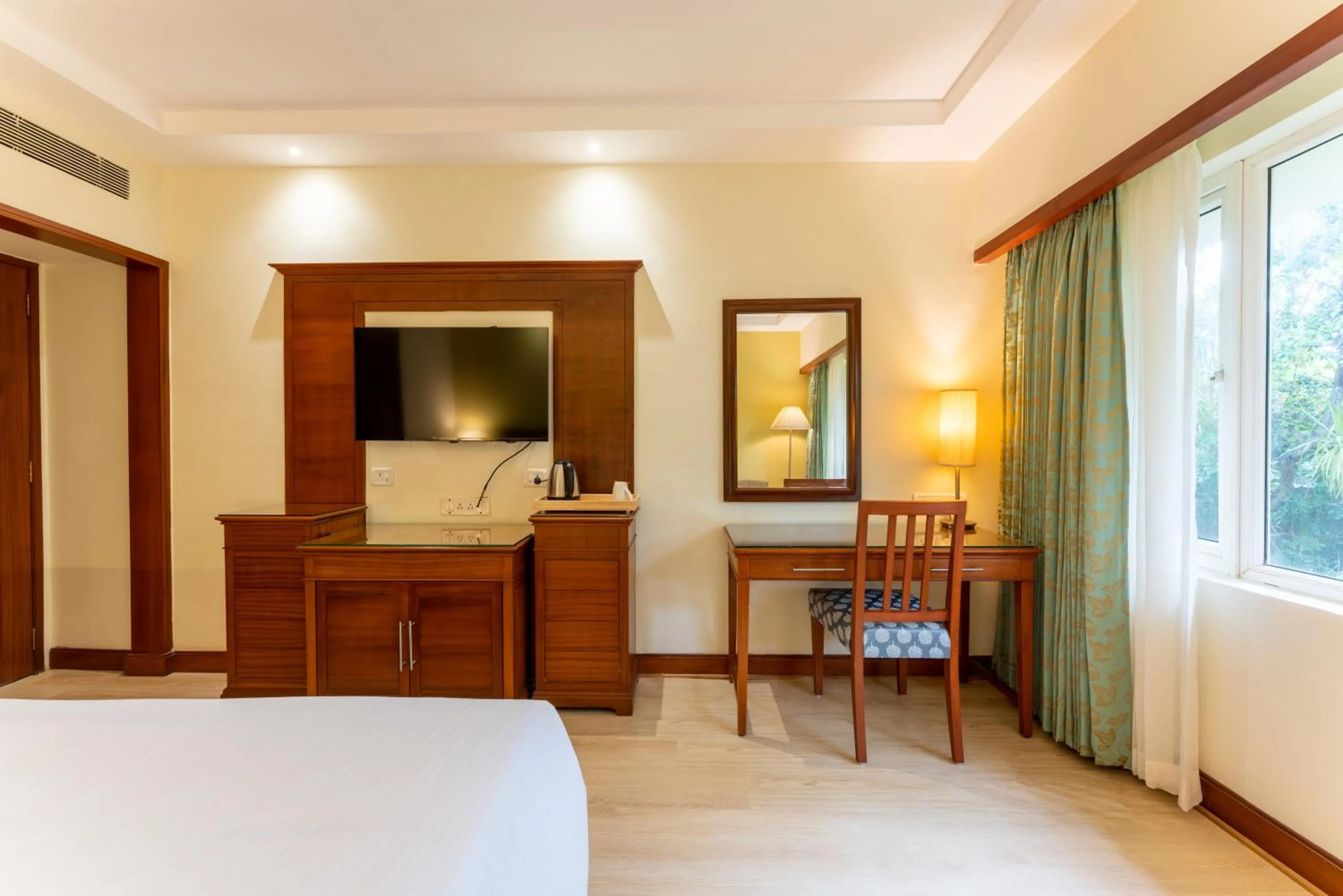 TV and multimedia, Bed in Club Mahindra Golden Landmark, Mysuru
