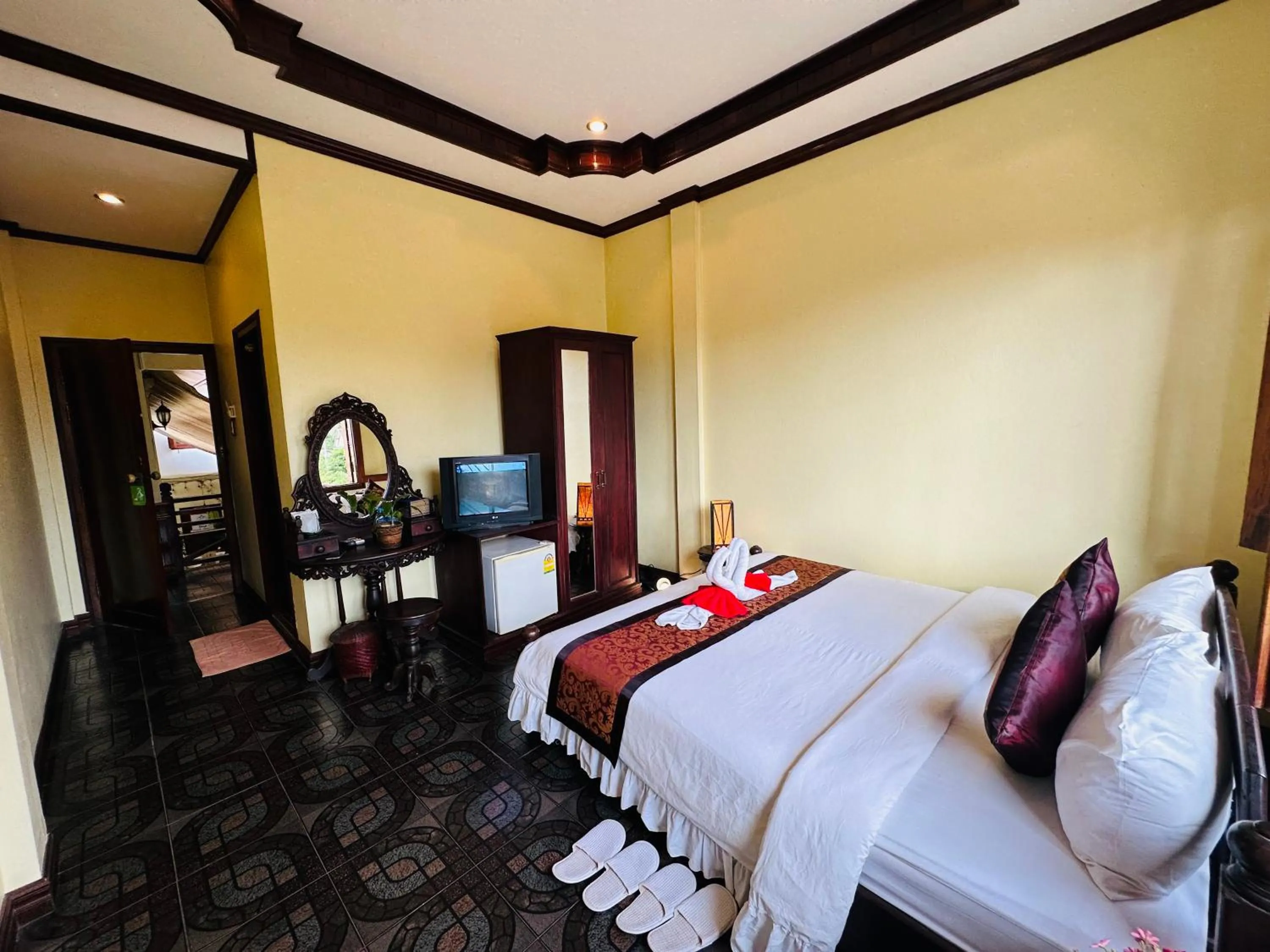 Communal lounge/ TV room, Bed in Visoun Luang Prabang Hotel