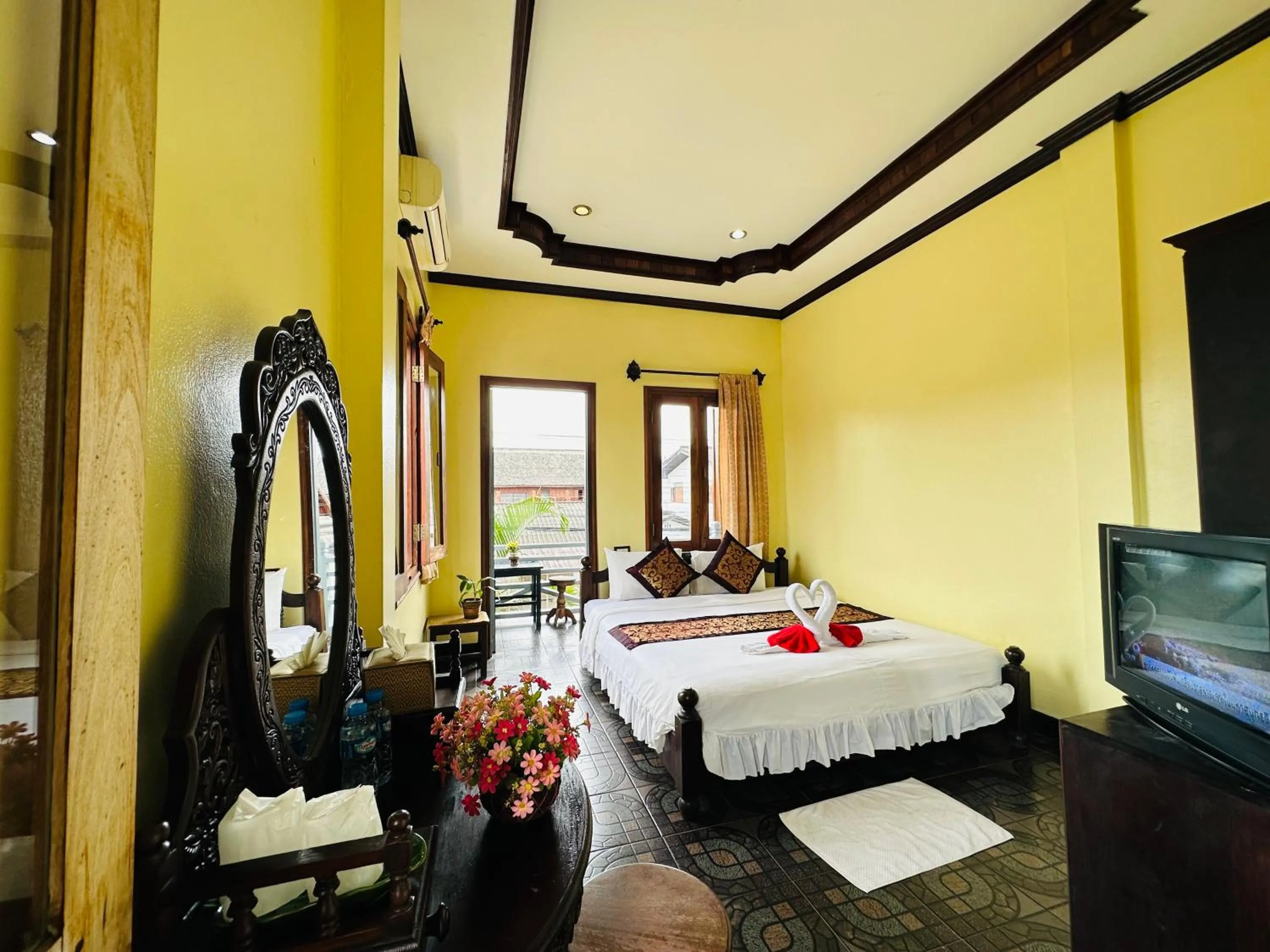 Communal lounge/ TV room, Bed in Visoun Luang Prabang Hotel