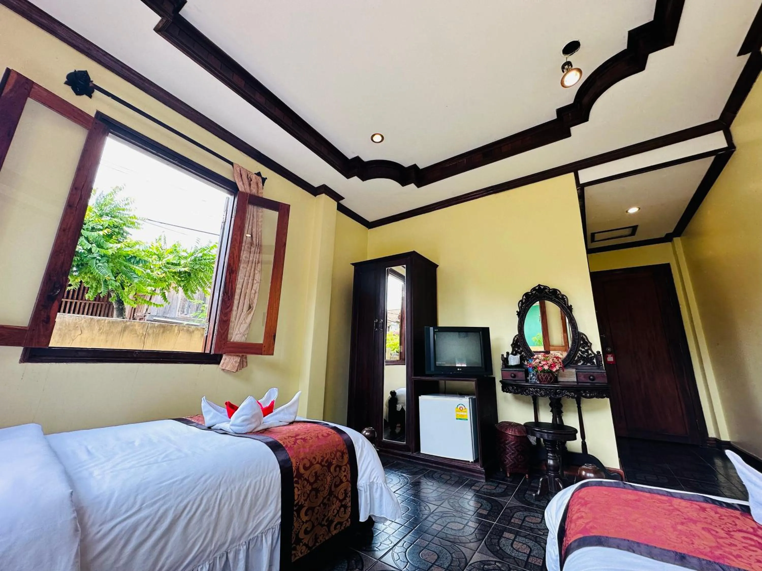 Communal lounge/ TV room, Bed in Visoun Luang Prabang Hotel