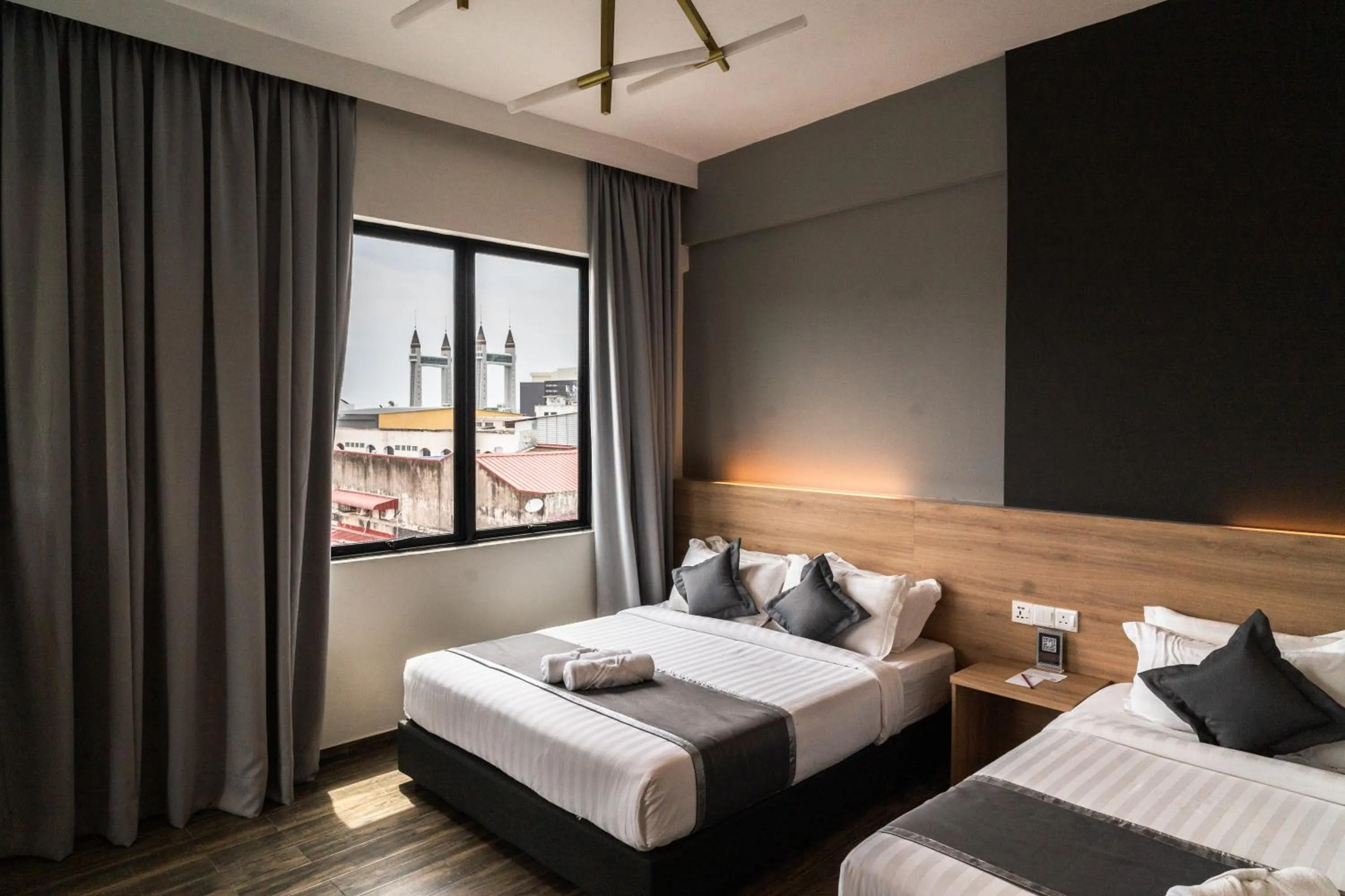 Bed in DJ Citi Plaza Hotel & Suites